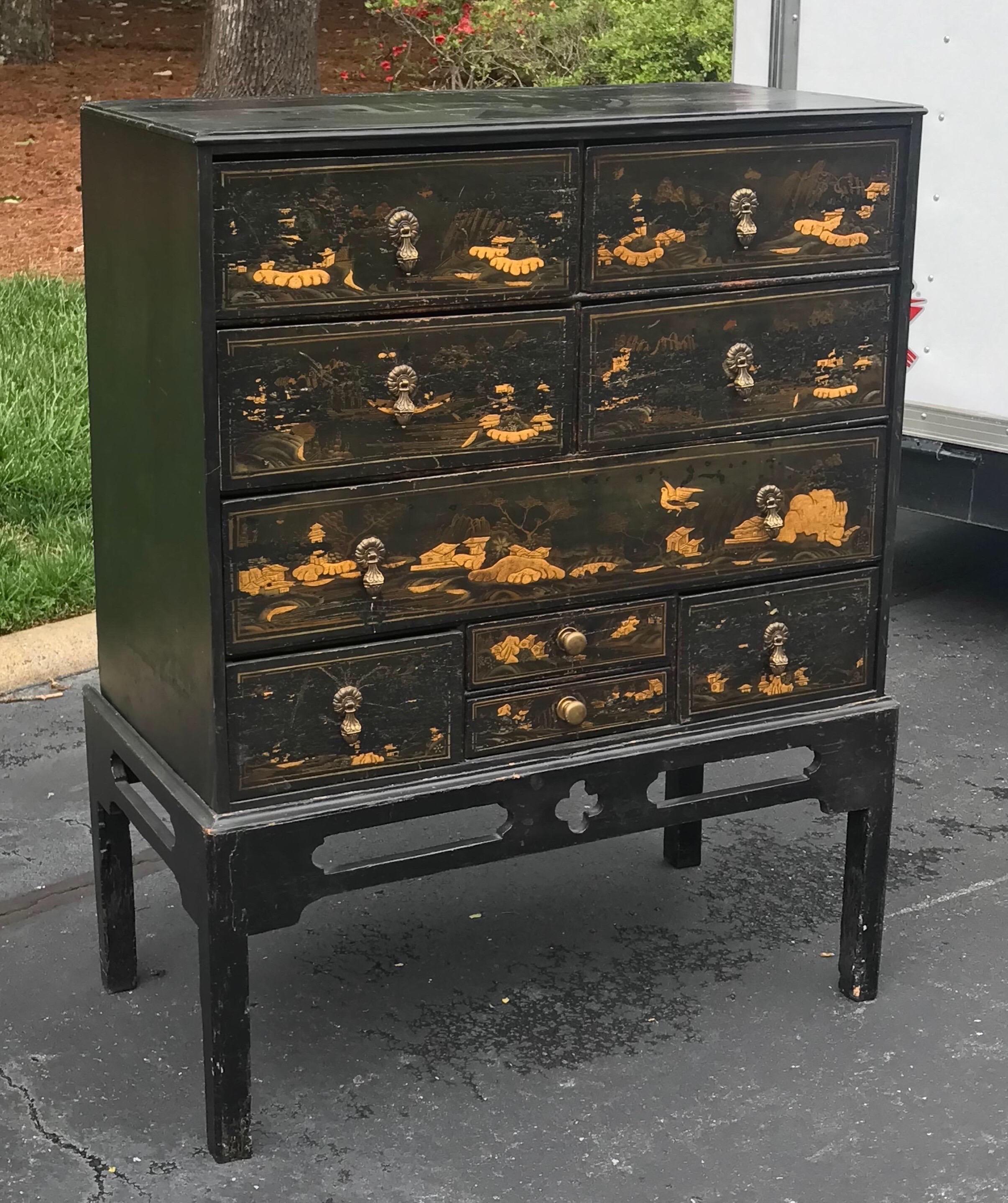 19th century English black lacquered chinoiserie chest on stand. Wonderful japanning throughout the 9 total drawers.