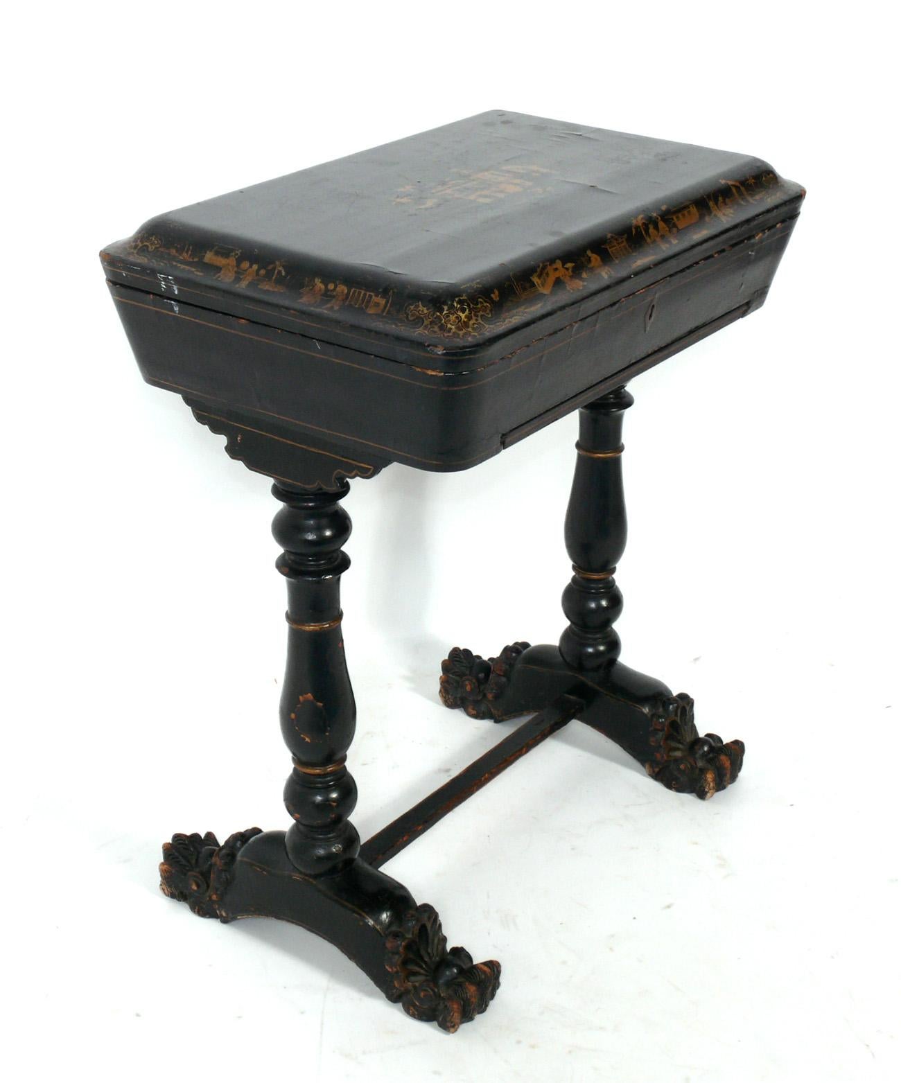 19th century chinoiserie table, probably Chinese export, circa late 19th century. This was probably originally intended as a sewing table, but it is a versatile size and can be used as a small console, desk, or foyer table, or as an end or side