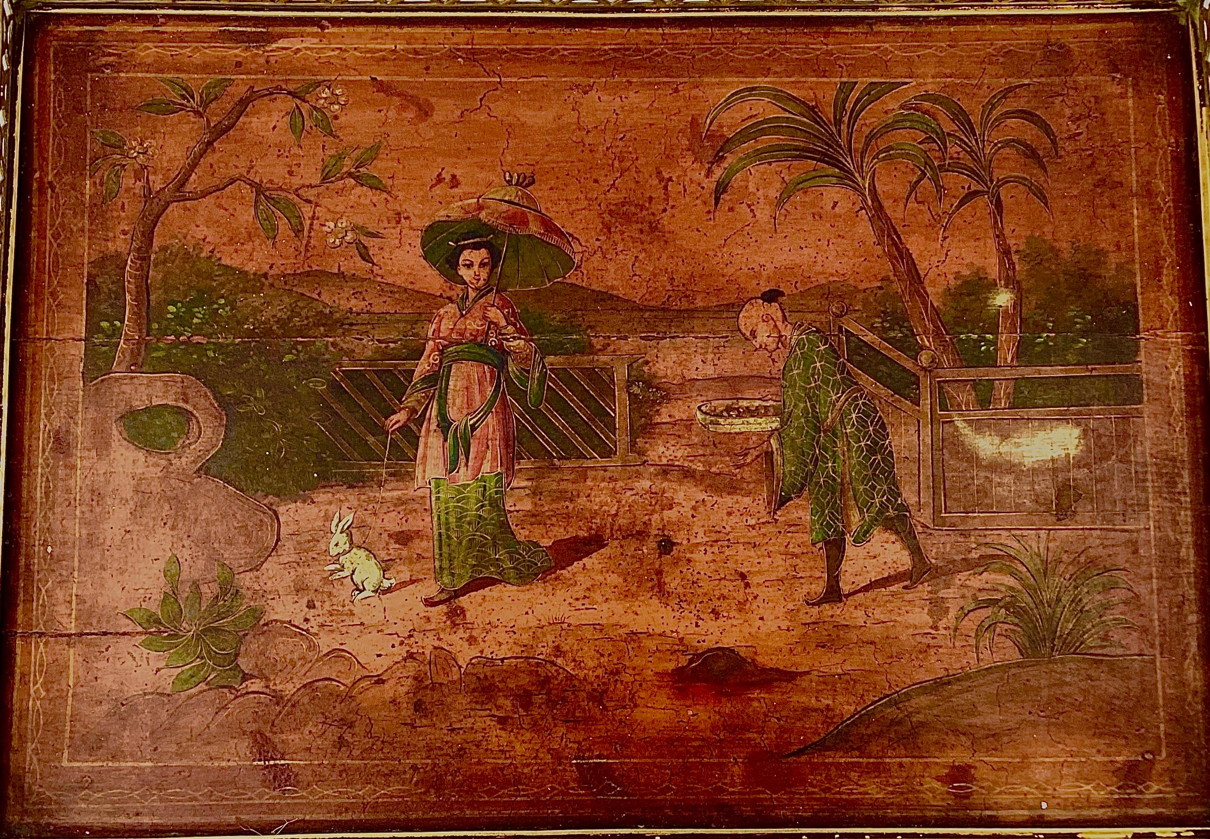 19th Century English Chinoiserie wooden side table with brass trim. Beautiful Asian scene with man, woman and her pet rabbit in an outdoor setting. This table can be used in any decor, in any room. 