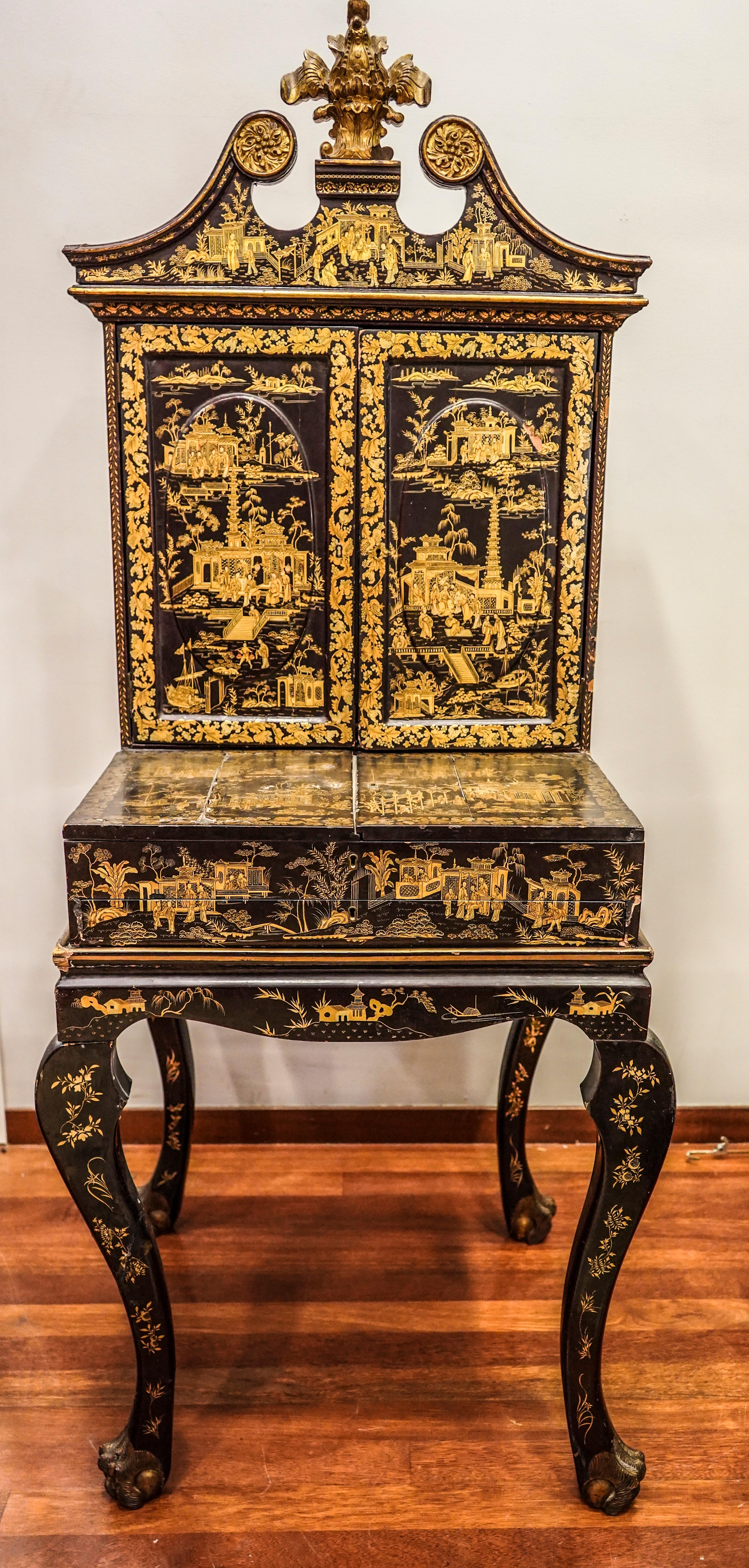 Stunning lacquered with chinoiseries Chinois cabinet made ordered to be exported and then the console was custom made in England .
Its a amazing piece with a lot of drawers and desk at the bottom. It has an extraordinary quality in the designs with