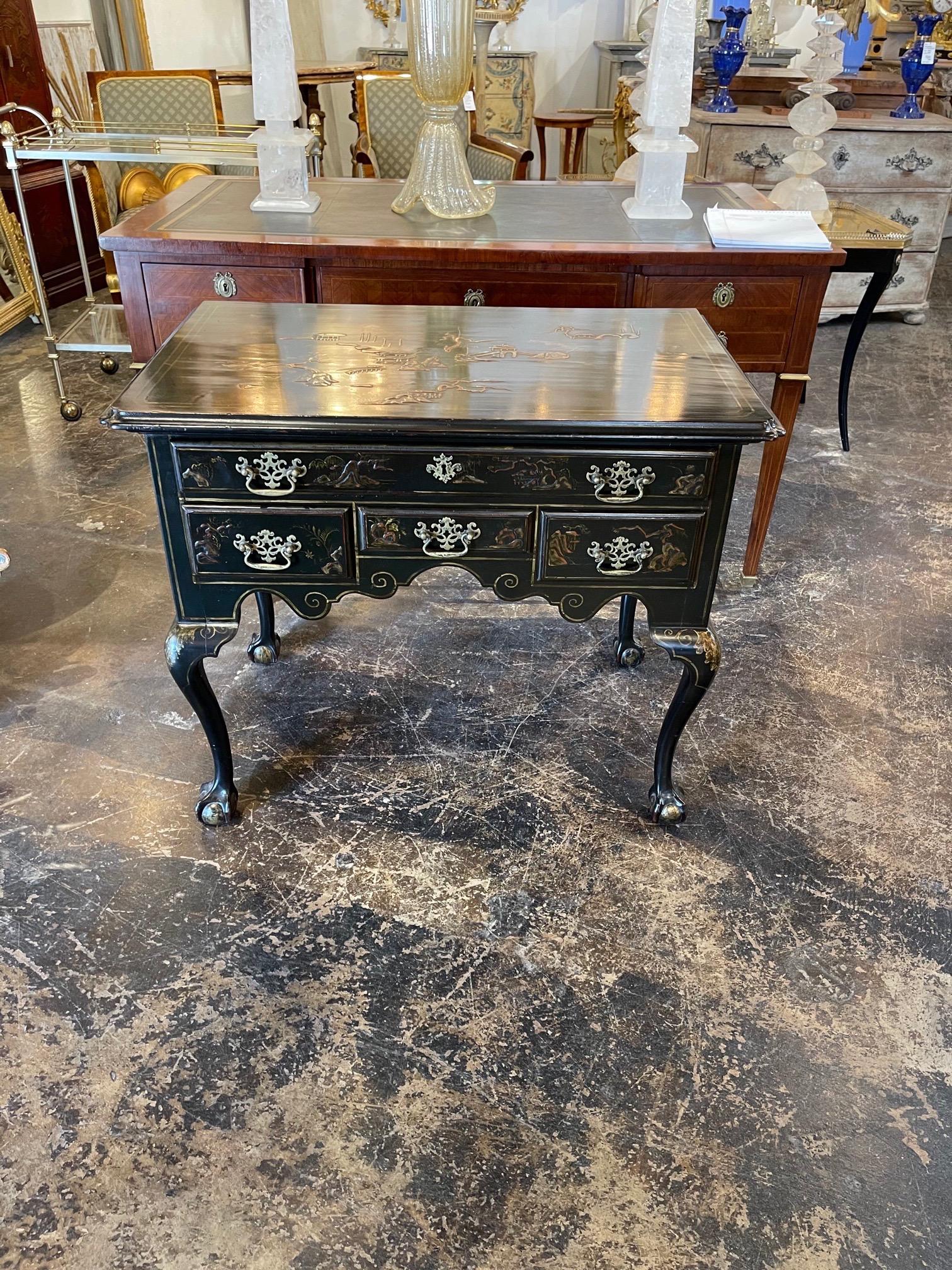 Elegant 19th century Chippendale black lacquered lowboy with beautiful hand-painted Chinoiserie design.
Lovely!