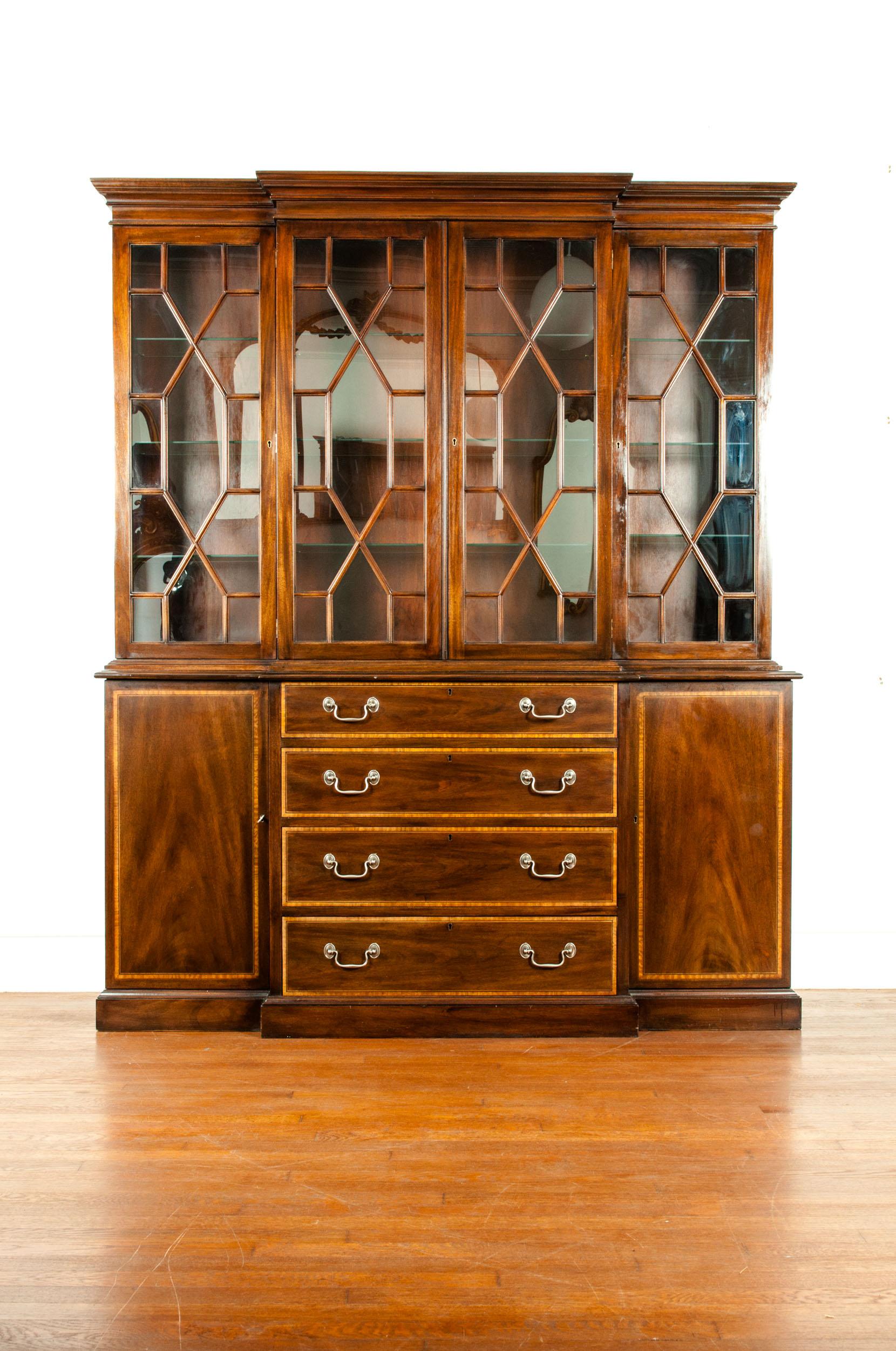 19th century Chippendale style mahogany wood china cabinet / Hutch with exterior design details. The hutch / china cabinet is very sturdy and in great antique condition with appropriate wear consistent with age / use. Maker's mark & stamped. The
