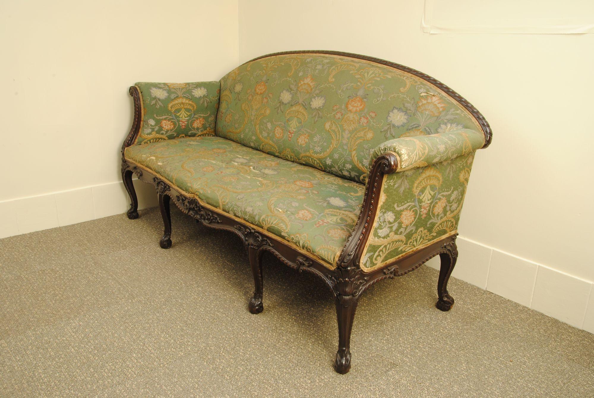 A late 19th century carved mahogany sofa with elegant cabriole legs, fine quality and design.