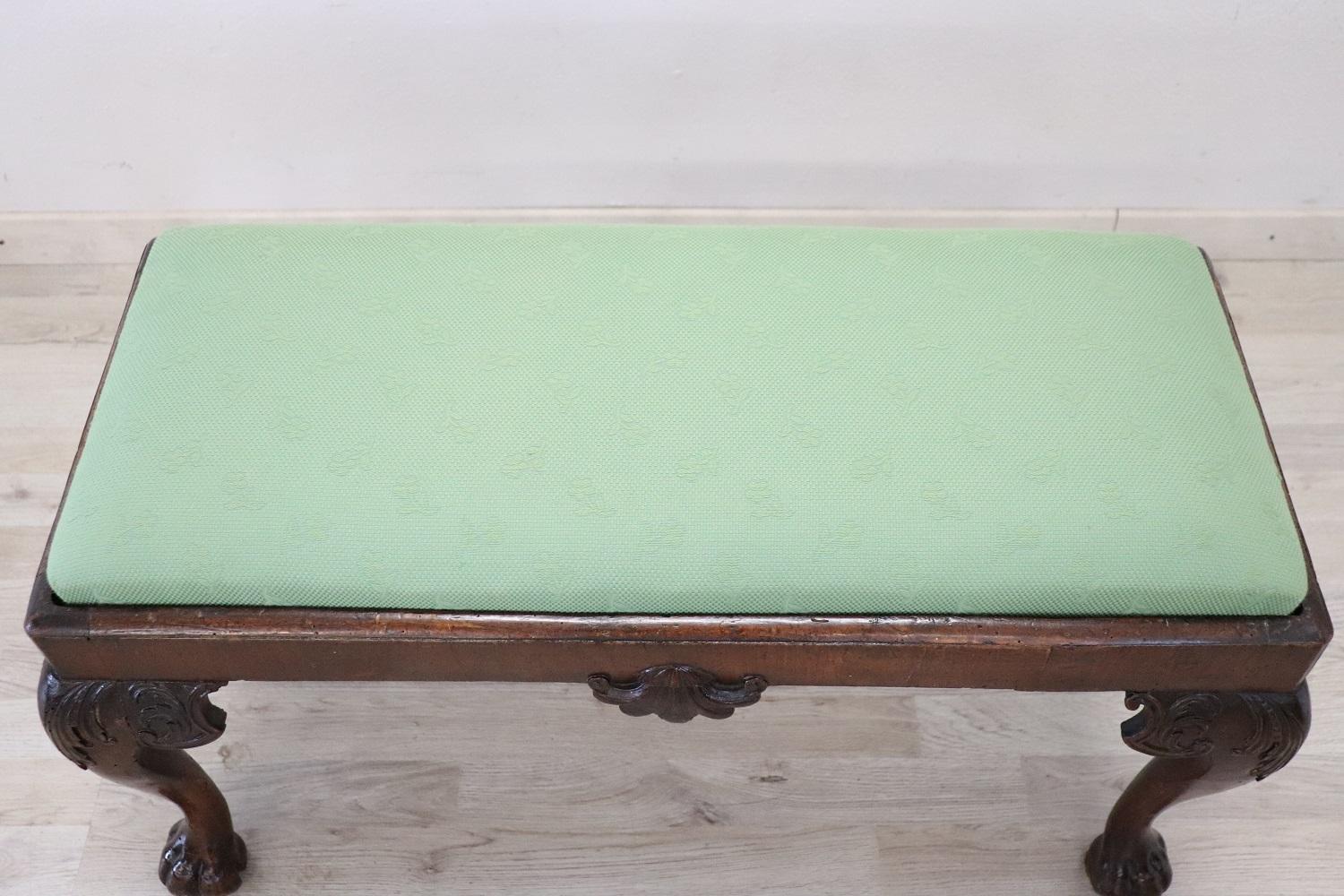 Beautiful english pouf or small bench in chippendale style, 1880s. Made of walnut with particular wavy legs that end with carved claw feet. Fully restored with an elegant green fabric. Perfect for embellishing small spaces and bedrooms.
 