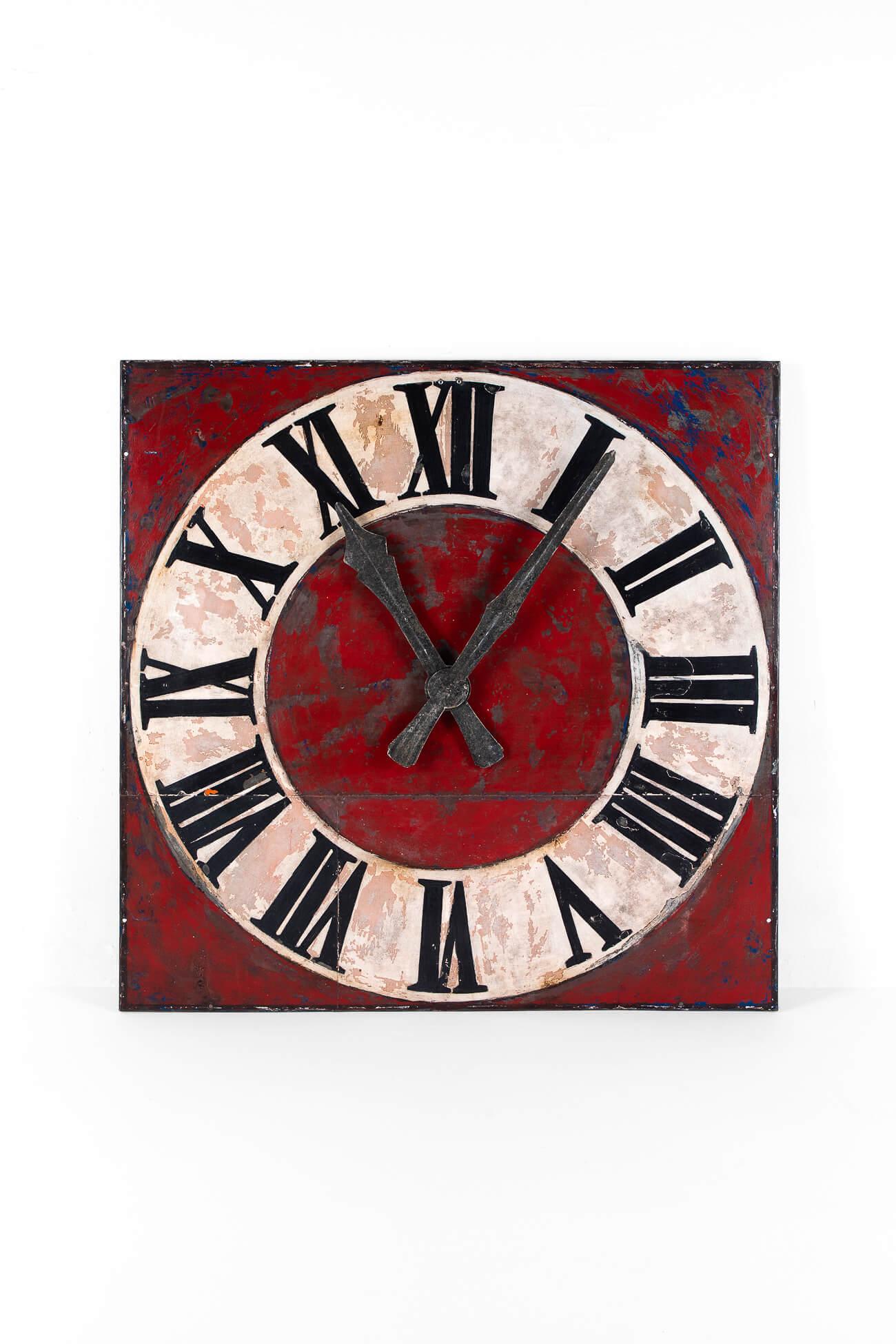A monumental church clockface from a chapel in northern France.

The dial on the face is hand-painted in black, white, and red, the colours fading over time to create the most wonderful patina.

This clock face was removed from the chapel clock
