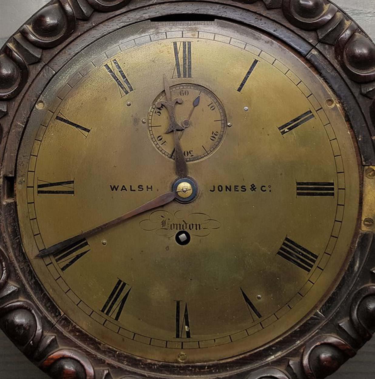 A scarce mid 19th century circular Marine oak cased wall clock of diminutive proportions, the brass dial with Roman numeral chapter ring and marked 