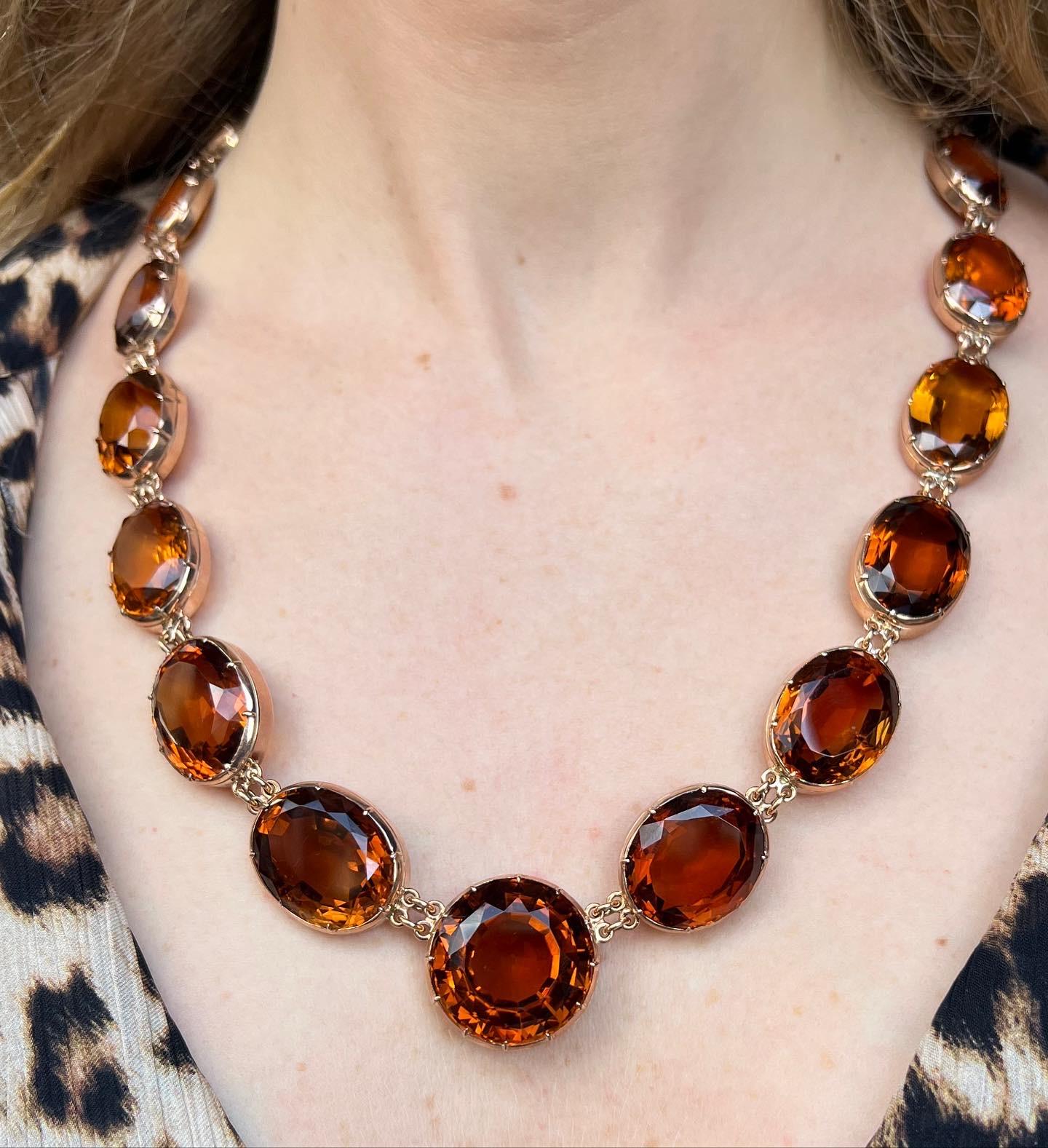 Rare XIX th century (19th) necklace in silver and gold set with amazing color oval citrines. The largest citrine is a round cut, set in the center of the necklace. 
Total citrines carat weight : 300 carats approximately.
The strong color of the