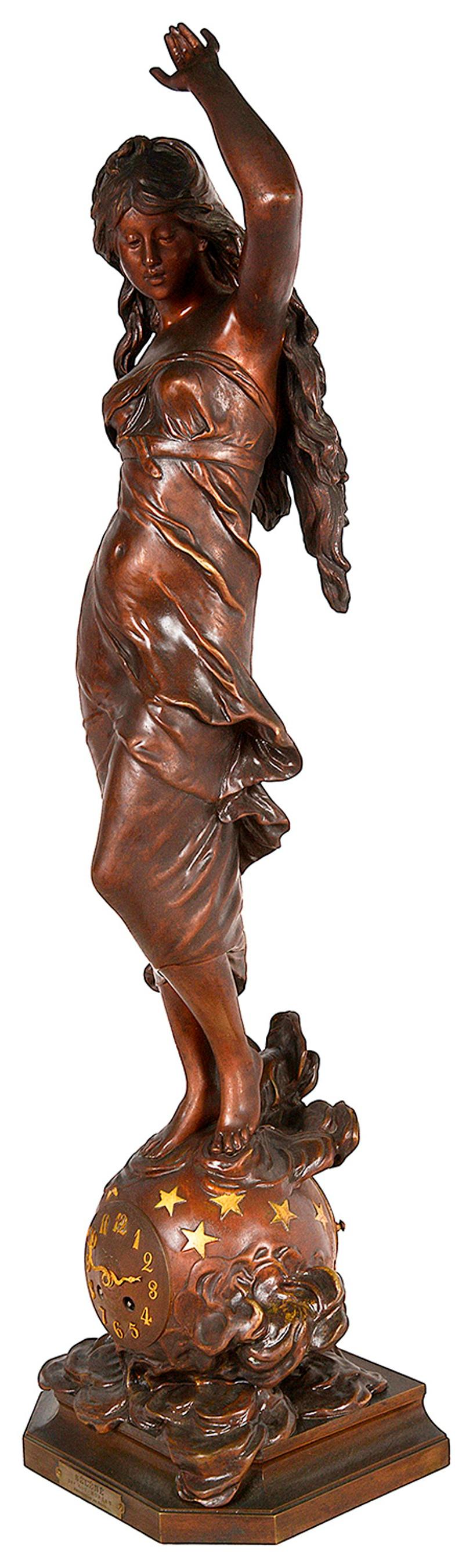 Bronze sculpture with brown patina including a clock and signed Auguste Moreau. It features a woman wearing a flowing dress who is standing on a globe. The title printed on a small plaque reads: SÉLÉNÉ par Aug. MOREAU and is annotated with: