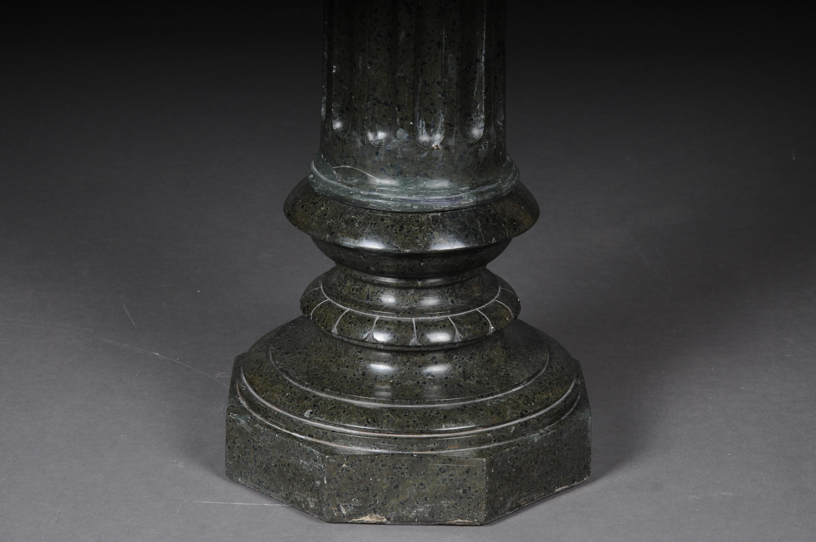 19th century Classicist granite column 
Black-green serpentine. Octagonal bottom and top plate, fluted shank. Traces of age and use available, circa 19th century.

(K - 35).