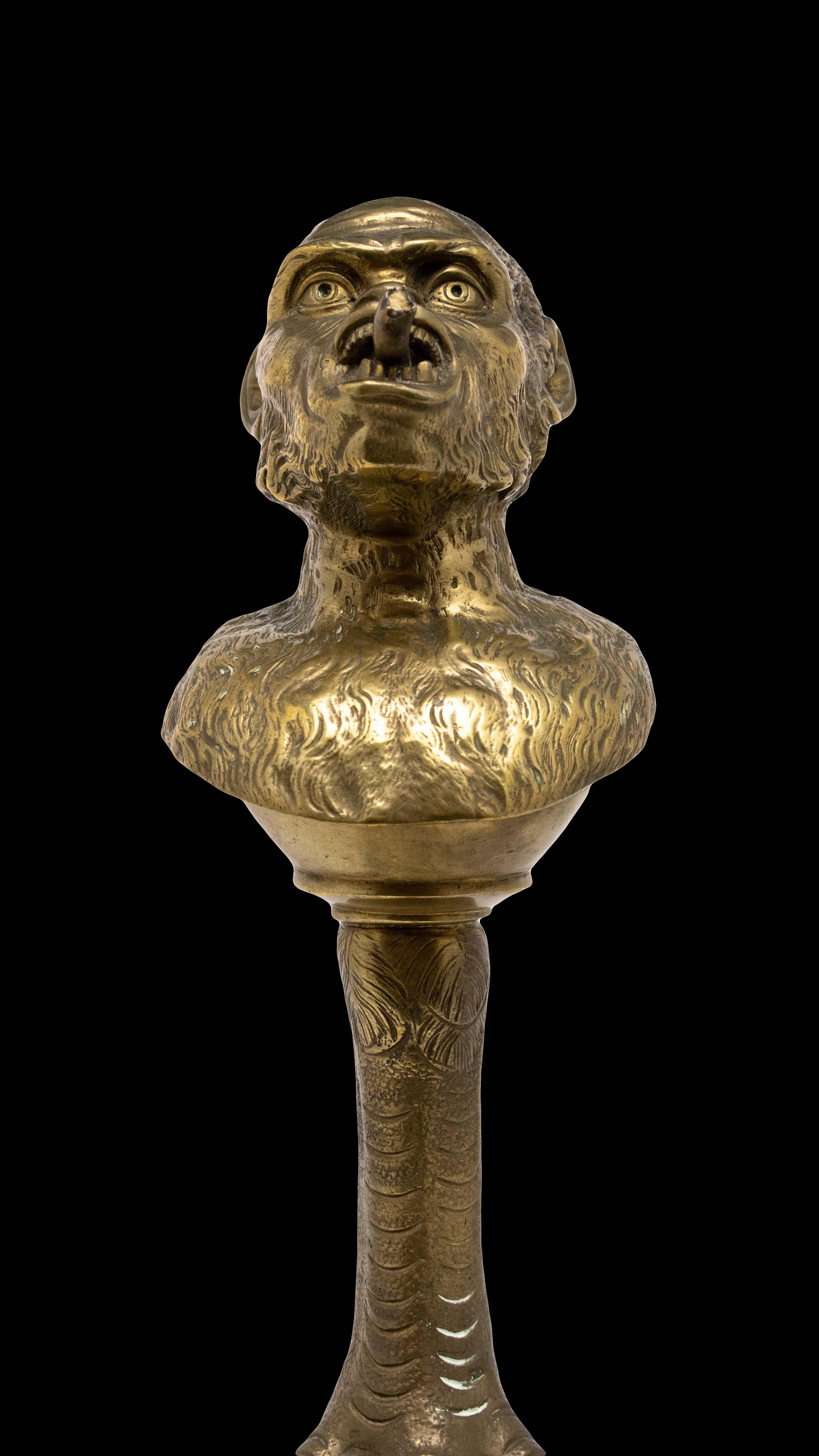 Very unusual 19th century Continental bronze tobacco cigar lighter. The beautifully cast head, smoking a cigar, is mounted on a bird claw. There is a reservoir that can be filled with oil through a hinged portion at the top. A wick can come out of