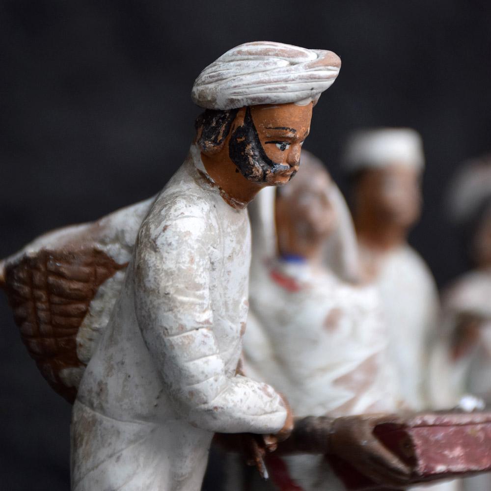 We are proud to offer a collection of late 19th century clay over wire framed Indian souvenir figures. Hand crafted and painted detail, these figures are wire formed over clay. Each figure represents a figure of the Indian workforce of the Victorian