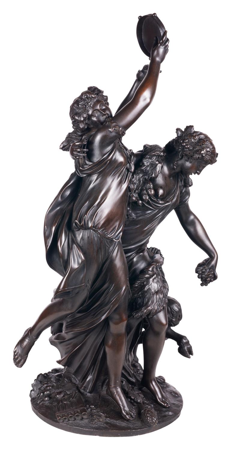 A fine French patinated bronze sculpture comprised of two buoyant, jubilant dancers and a satyr pictured in Bacchic revelry. Both female figures wear flowing tunics with masses of fine drapery folds. One young bacchante upholds a tambourine, while