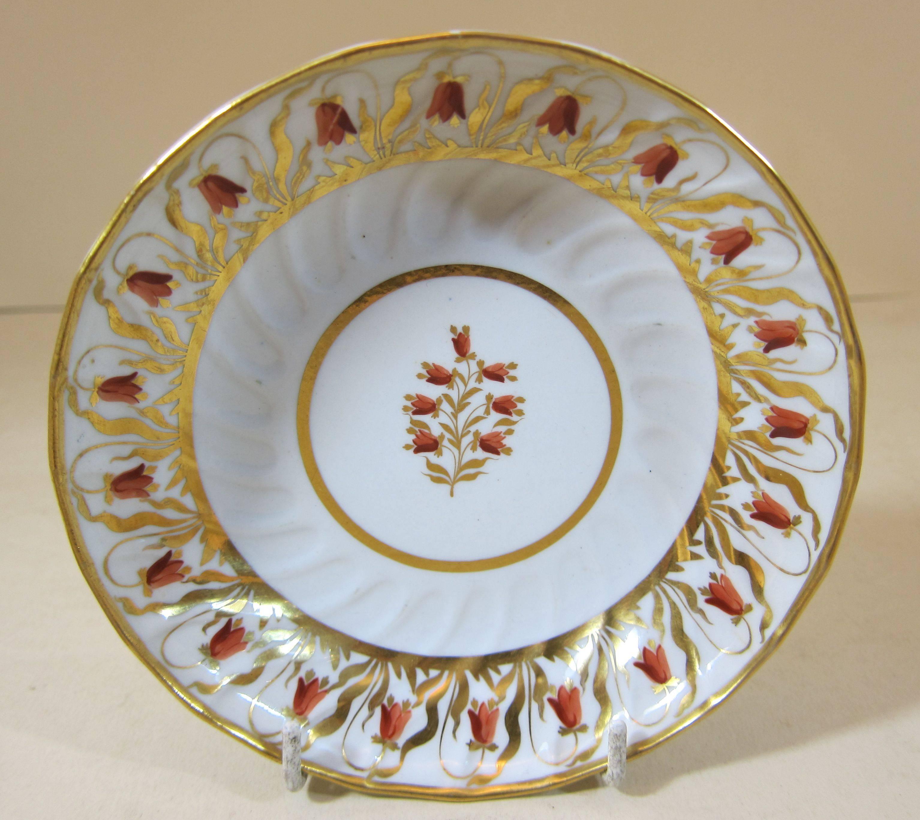 Coalport (worked from circa 1795)
An antique Coalport Porcelain fluted tea bowl and saucer decorated with gilt and orange harebells.