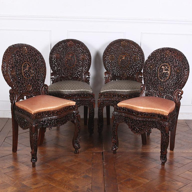 Unusual set of four pierce-carved Anglo-Indian chairs, completely covered with minutely-carved vines, leaves, flowers etc and a lion in the centre of each back, circa 1880.


 