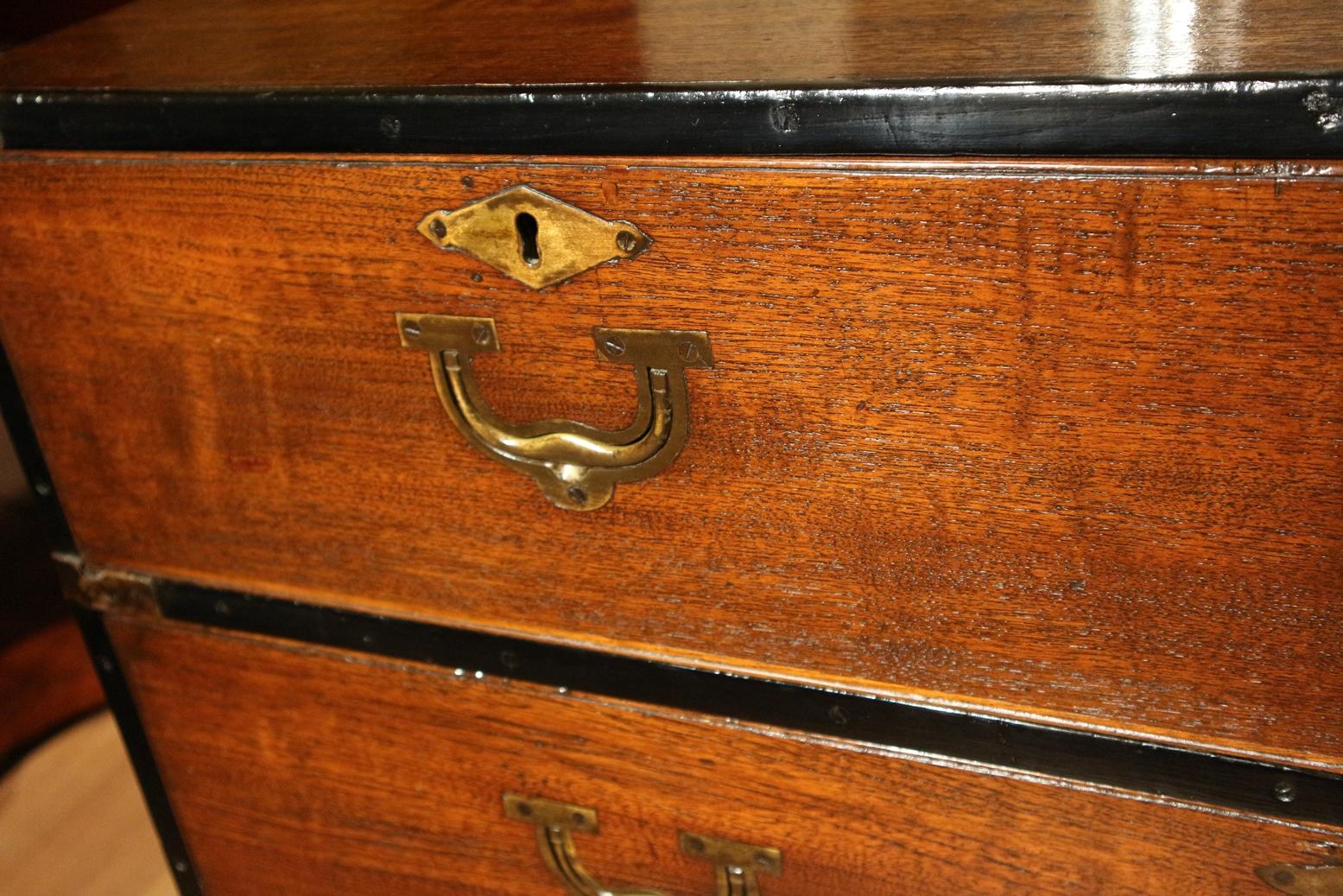 Special antique colonial Campaign chest of drawers in good condition. Nice drawer pullers. Special is that the front is equipped with special details. The cabinet consists of 2 parts and has carrying handles on the sides. This type of cabinets was