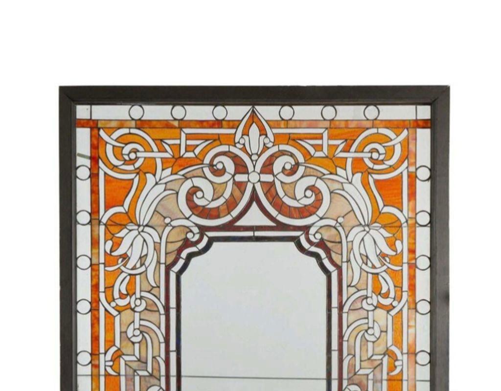 Leaded glass window, 19th century.

The beveled leaded window with opalescent glass, amber ripple glass, and c-scroll designs

Dimensions
Sight: 80