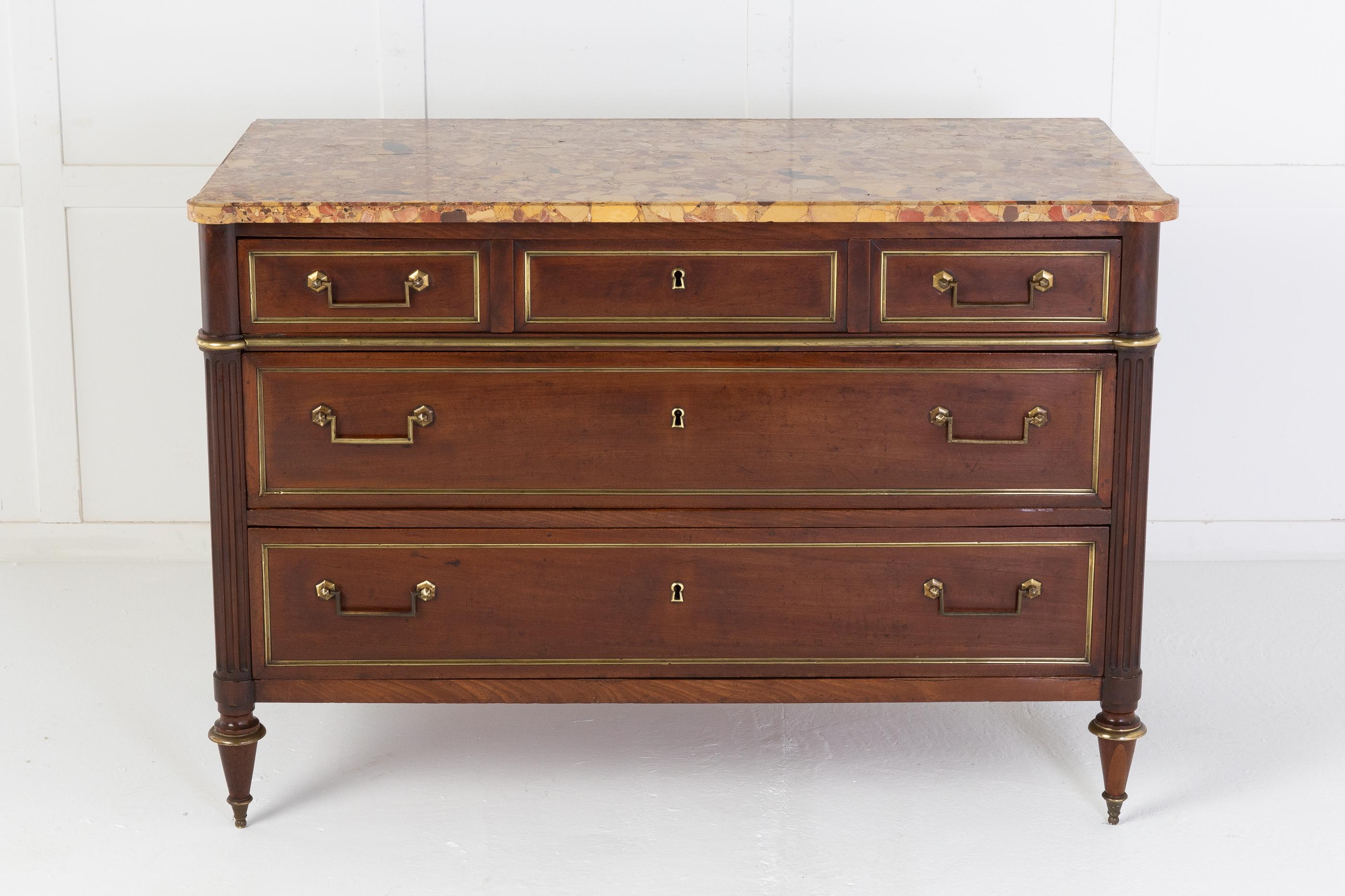 Well proportioned French 19th century commode with a very nice marble top. Three drawers across the top and two below, each drawer having brass panelled mounts and rectangular handles flanked by fluted turned columns. Raised on tapering toupie feet