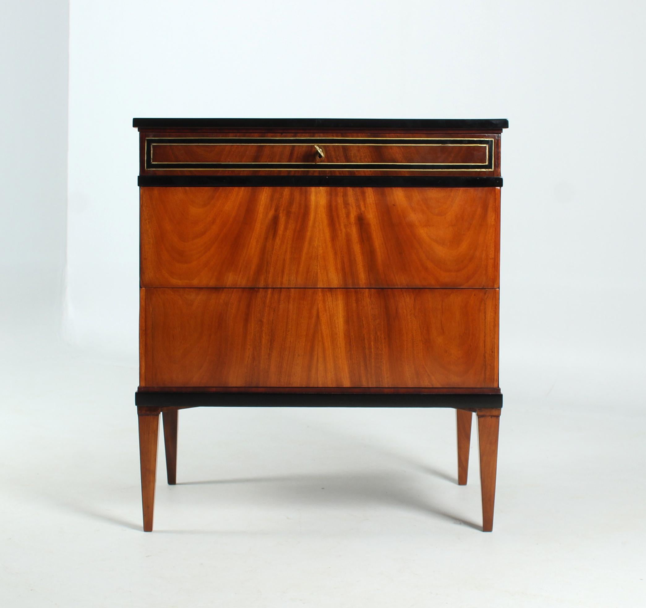 Small antique Biedermeier commode with trick lock

West Germany
early 19th century

Dimensions: H x W x D: 83 x 74 x 47 cm

Description:
Strictly cubist, three-bay piece of furniture standing on pointed feet.

We see a very calm, simply