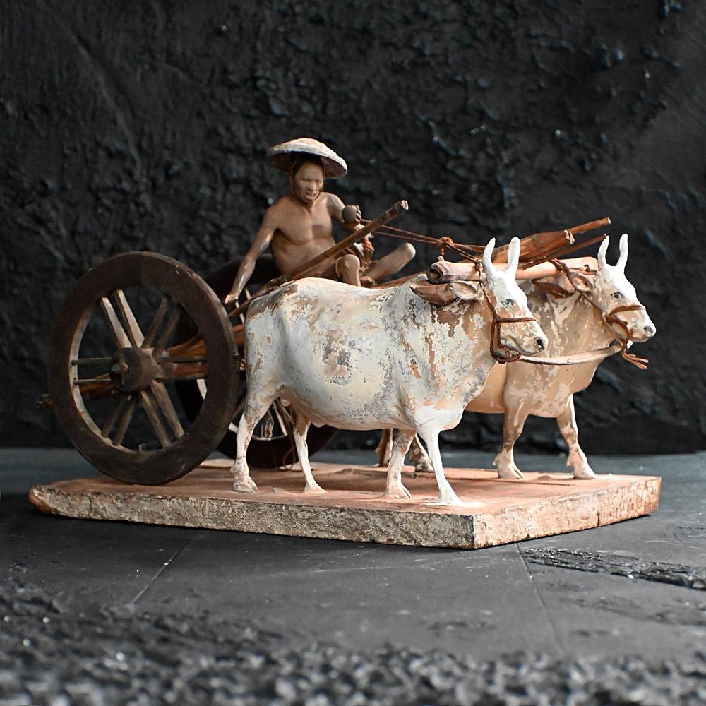 19th Century Company school terracotta oxen and cart museum figure 
A rare form of mid-19th century Company school terracotta figure. With painted detail across the wood and terracotta base, a hand-crafted wood and bamboo cart upon which a