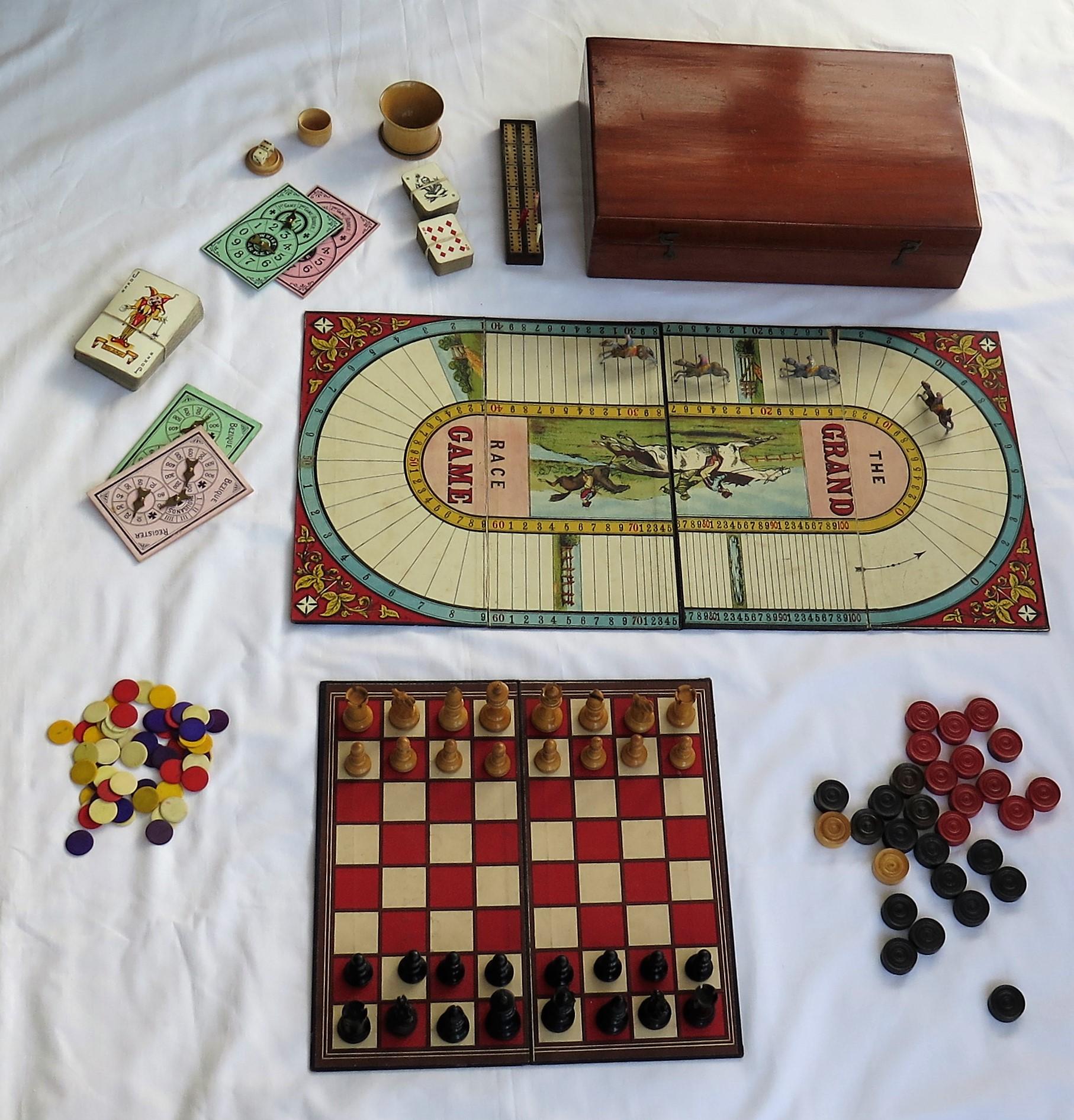 This is a high quality Games Compendium, complete with over 8 individual games, all in its original hardwood storage box with a hinged lid.

All the pieces are well made and complete.

The box is made of a jointed hardwood, possibly red walnut and