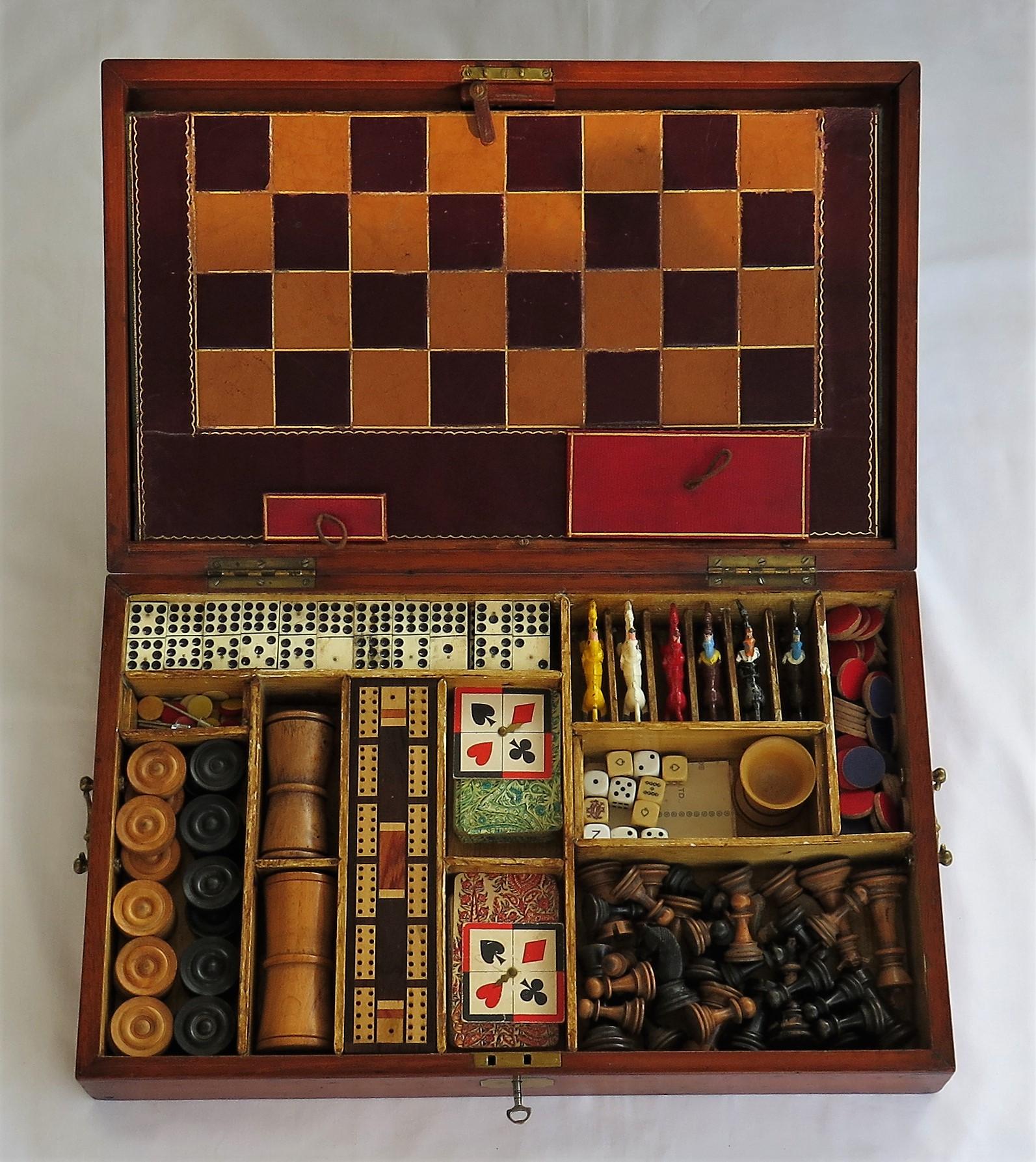 This is a high quality Games Compendium, complete with over 10 individual games in its original hardwood storage box with a hinged lid.

All the pieces are well made and complete.

The box is made of a jointed hardwood, possibly mahogany and is