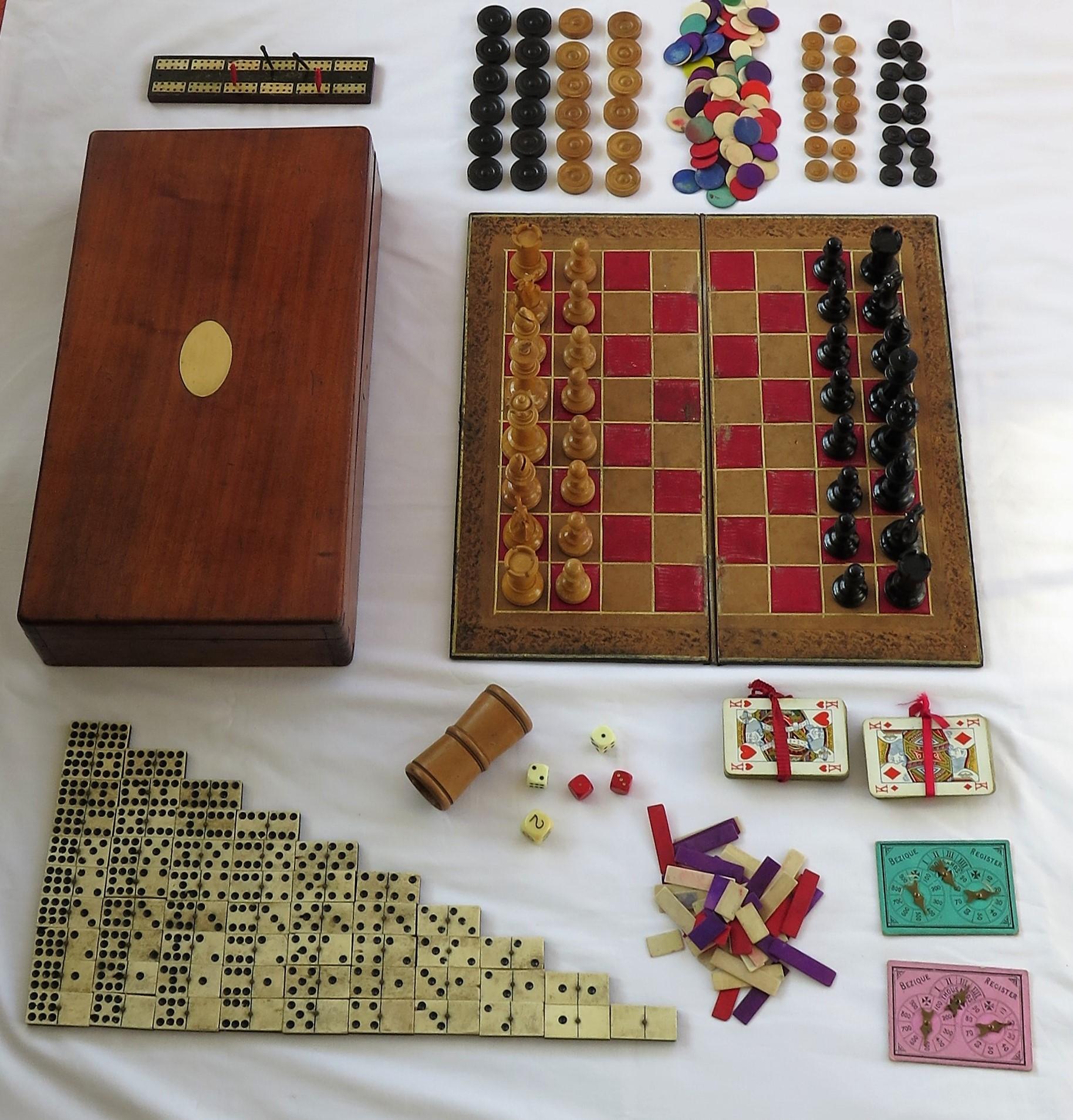 This is a high quality large Games Compendium, complete with many individual games in its original hardwood storage box with a hinged lid.

All the pieces are well made and complete.

The box is very well made of a jointed hardwood, possibly red