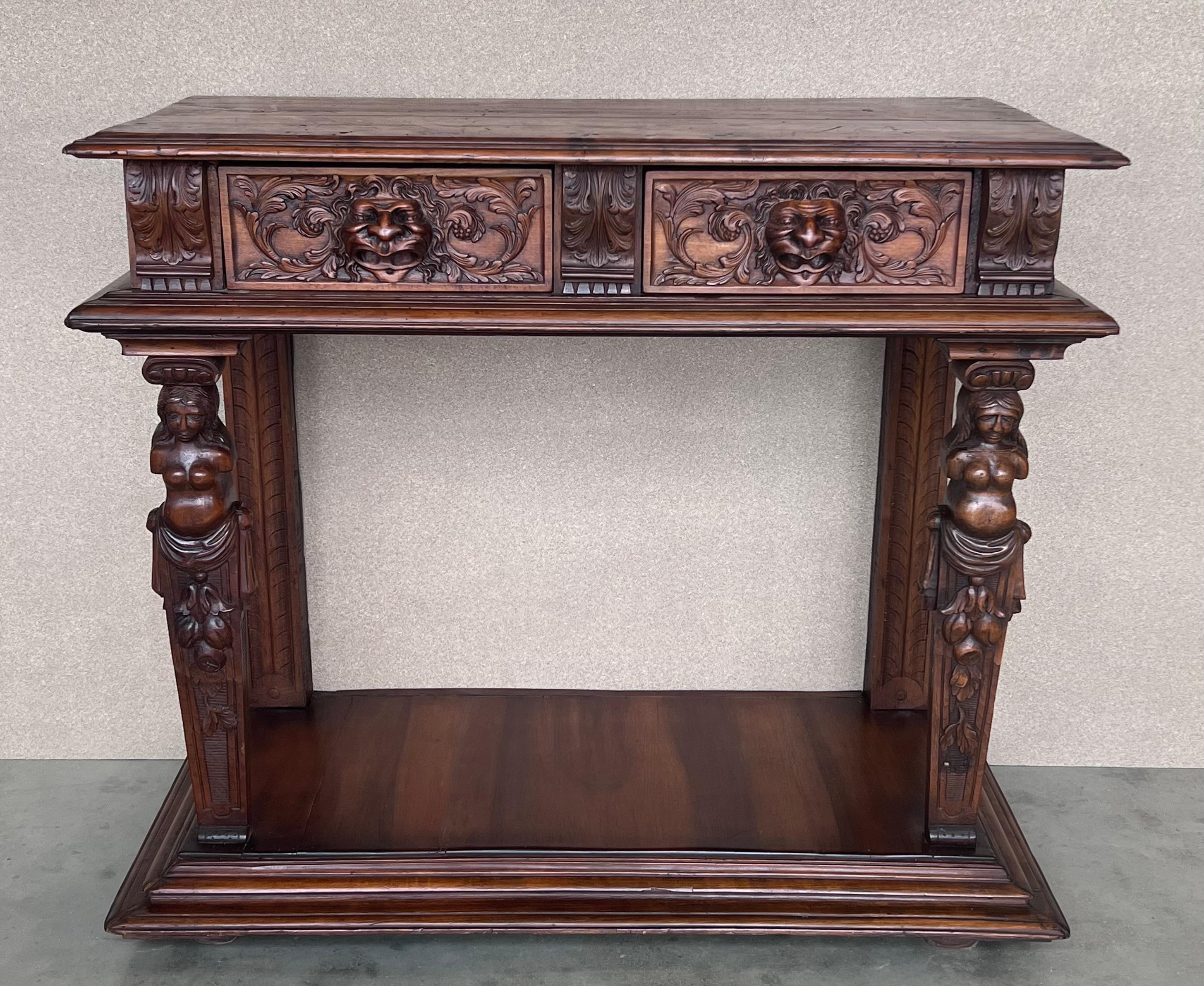 20th century console carved table Renaissance made of solid walnut wood 
It features carvings of mythological animals and plant motifs. Foot with turned rear columns and front columns in the form of mythological figures.