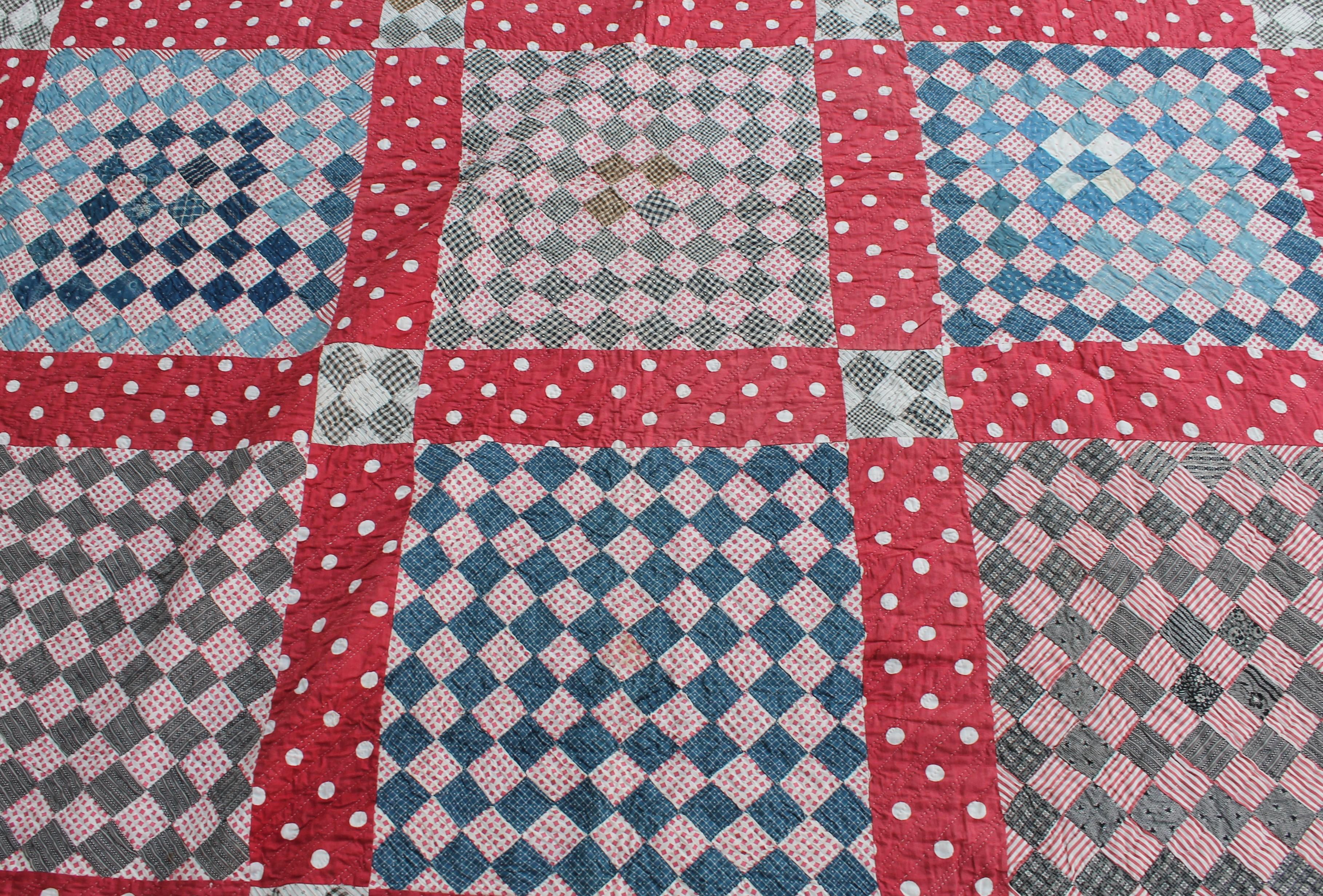 This finely pieced contained postage stamp quilt is in good condition with a overall even fade throughout but in good condition. Great piecework and quilting.