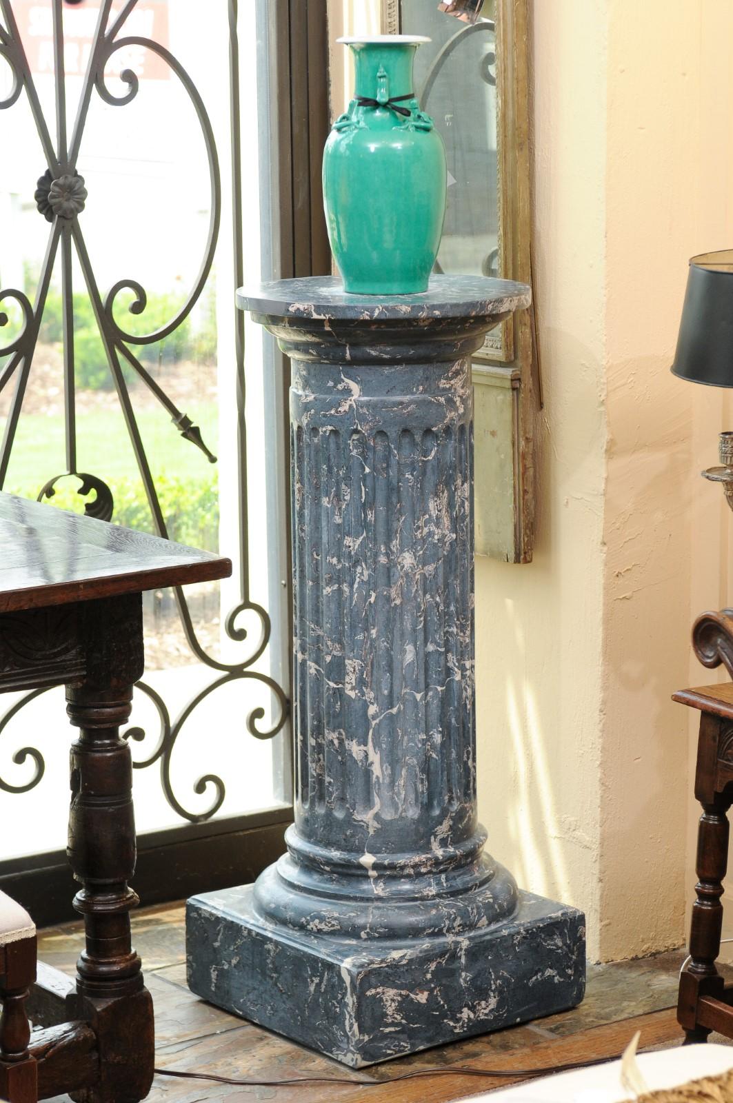 The 19th century continental blue marbleized painted terracotta pedestal featuring fluting detail and square base.

 