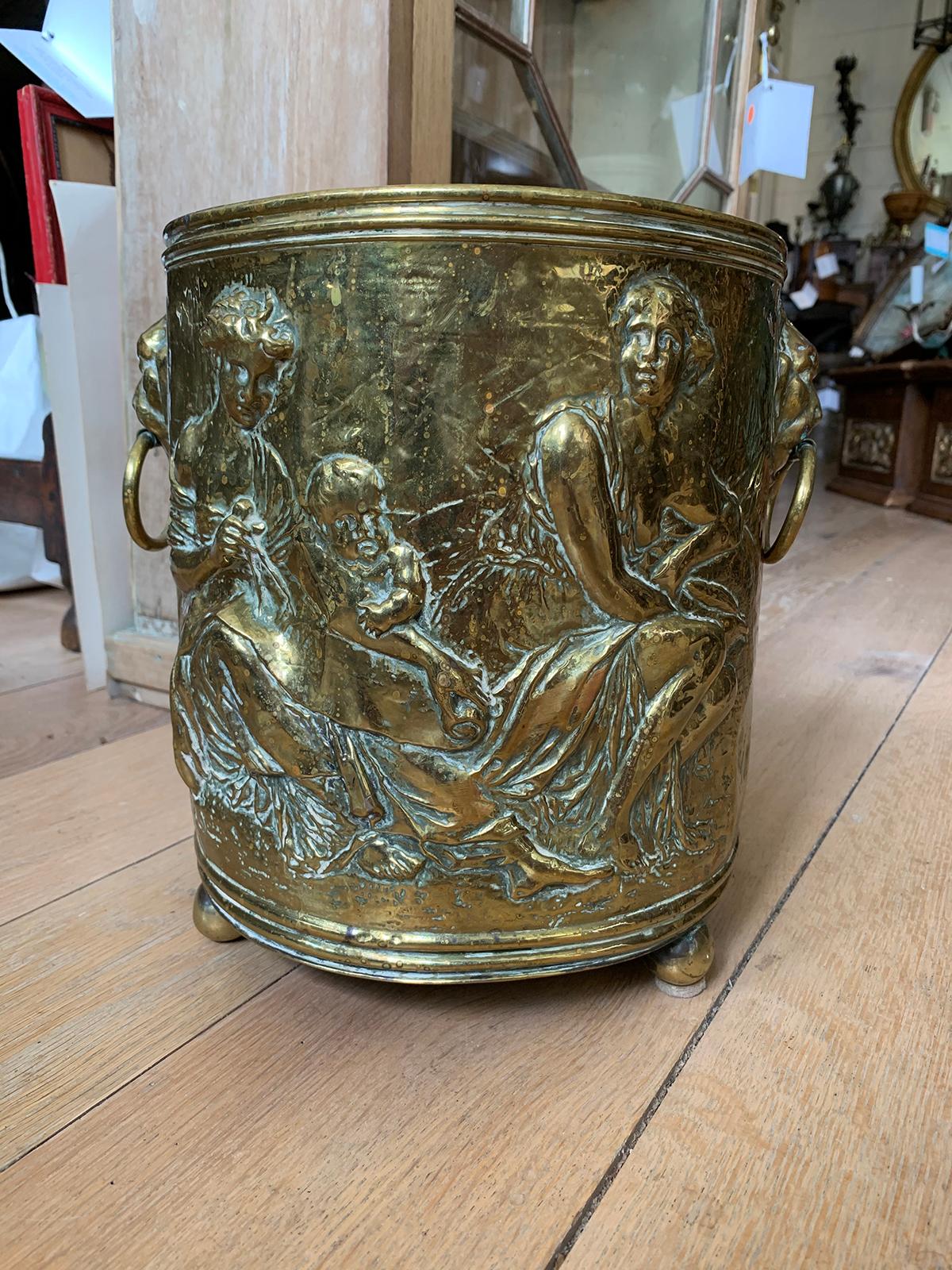 19th century continental brass cachepot with lion pulls.