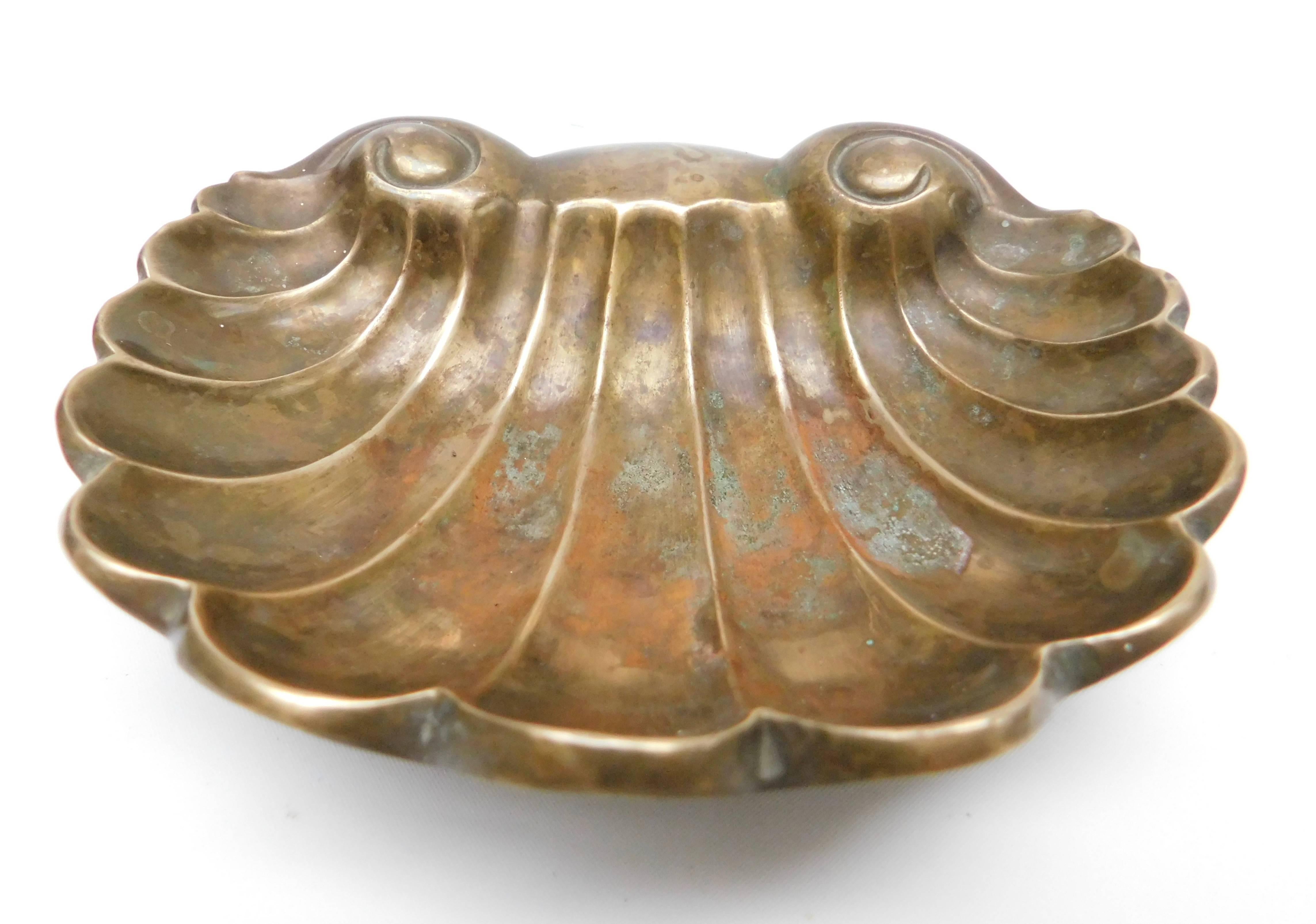 19th century Continental cast bronze dish in a shell shaped form. Cast in solid bronze with an exceptionally lovely red and green patina achieved from over 100 years of use holding soaps and sponges next to the bath. The dish is made with one back