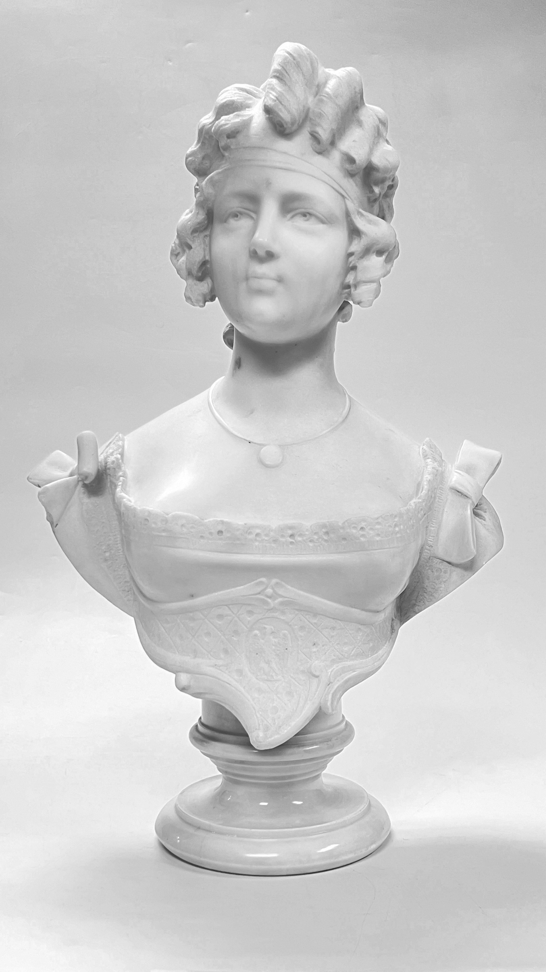 Fine antique (19th century) continental bust of a lovely female in curls and dress adorned with bows at the shoulder.  Apparently unsigned.