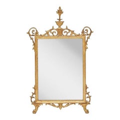 19th Century Continental Giltwood Mirror With Urn and Flame Crest