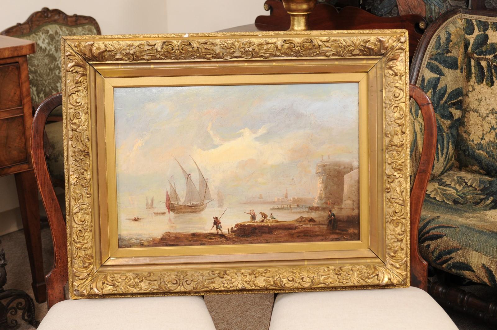 The 19th century continental oil on canvas painting of harbor with sailboats in carved giltwood frame.