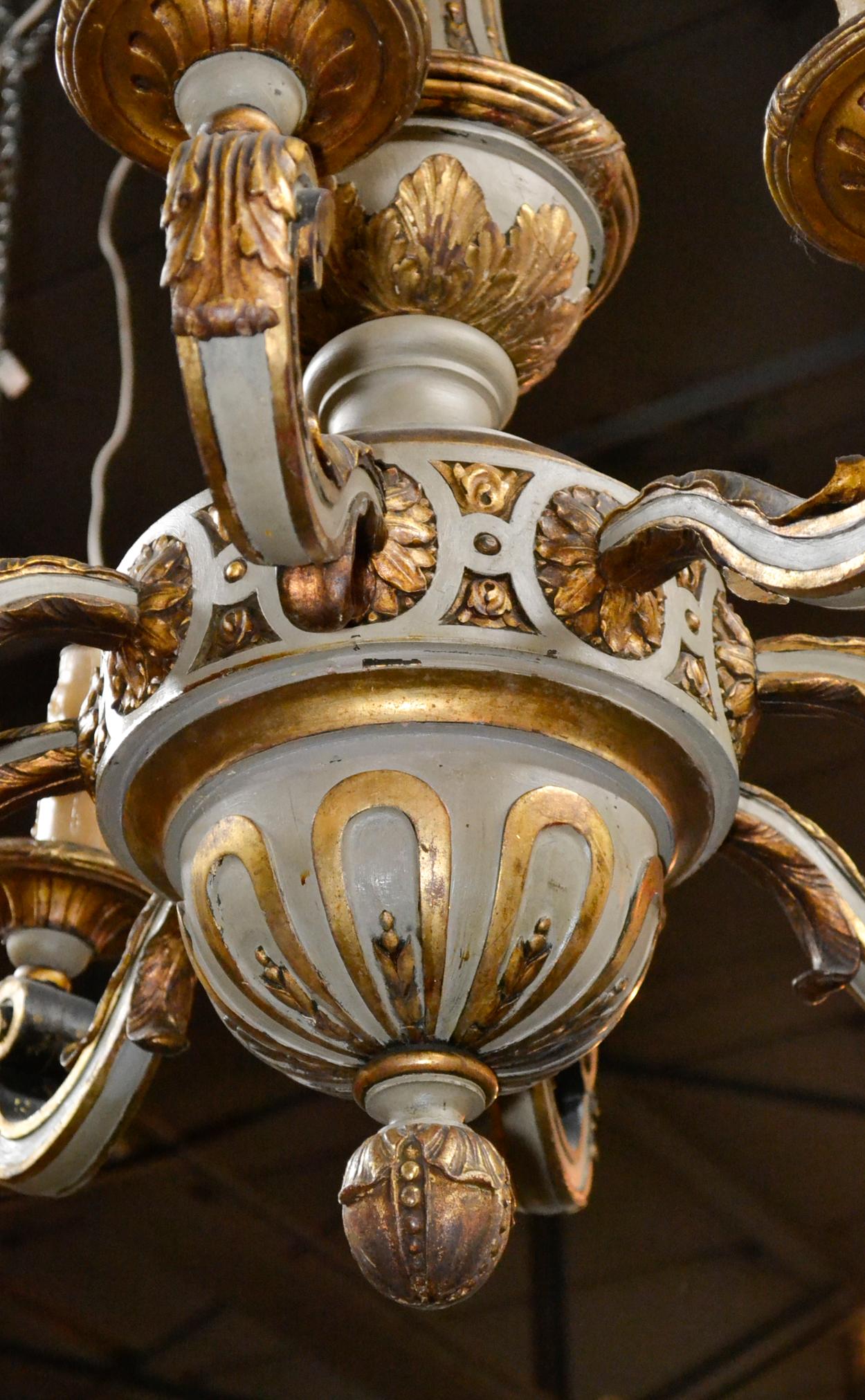 Alluring 19th century continental carved and parcel-gilt 8-light chandelier.
  