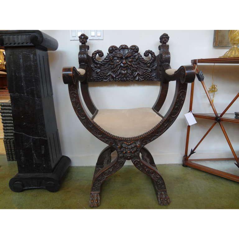 19th Century Continental Renaissance Style Savonarola chair.
Handsome antique Continental Renaissance style walnut Savroarola chair, side chair, armchair or throne chair. This beautifully carved Gothic style chair is upholstered in suede with nail