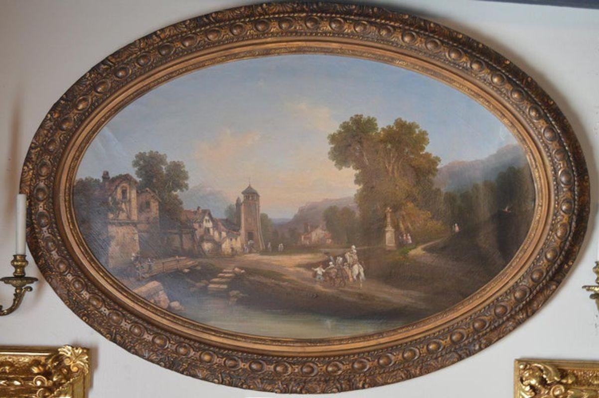 Continental, likely German, 19th century. Oil on canvas, housed in a gilt oval frame. A town scene, unsigned.
