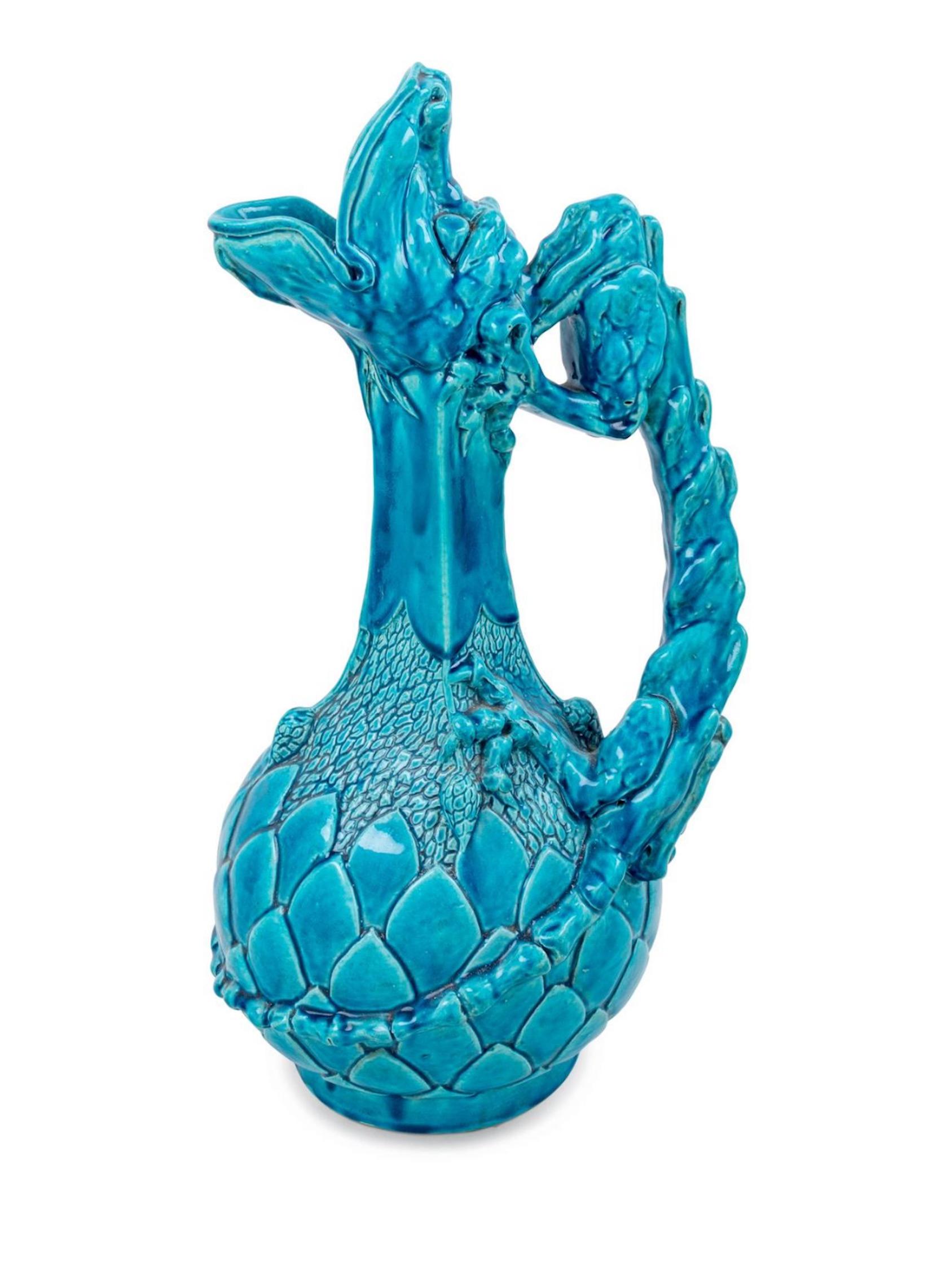 A 19th century continental turquoise glazed figural ewer with dragon form handle 18