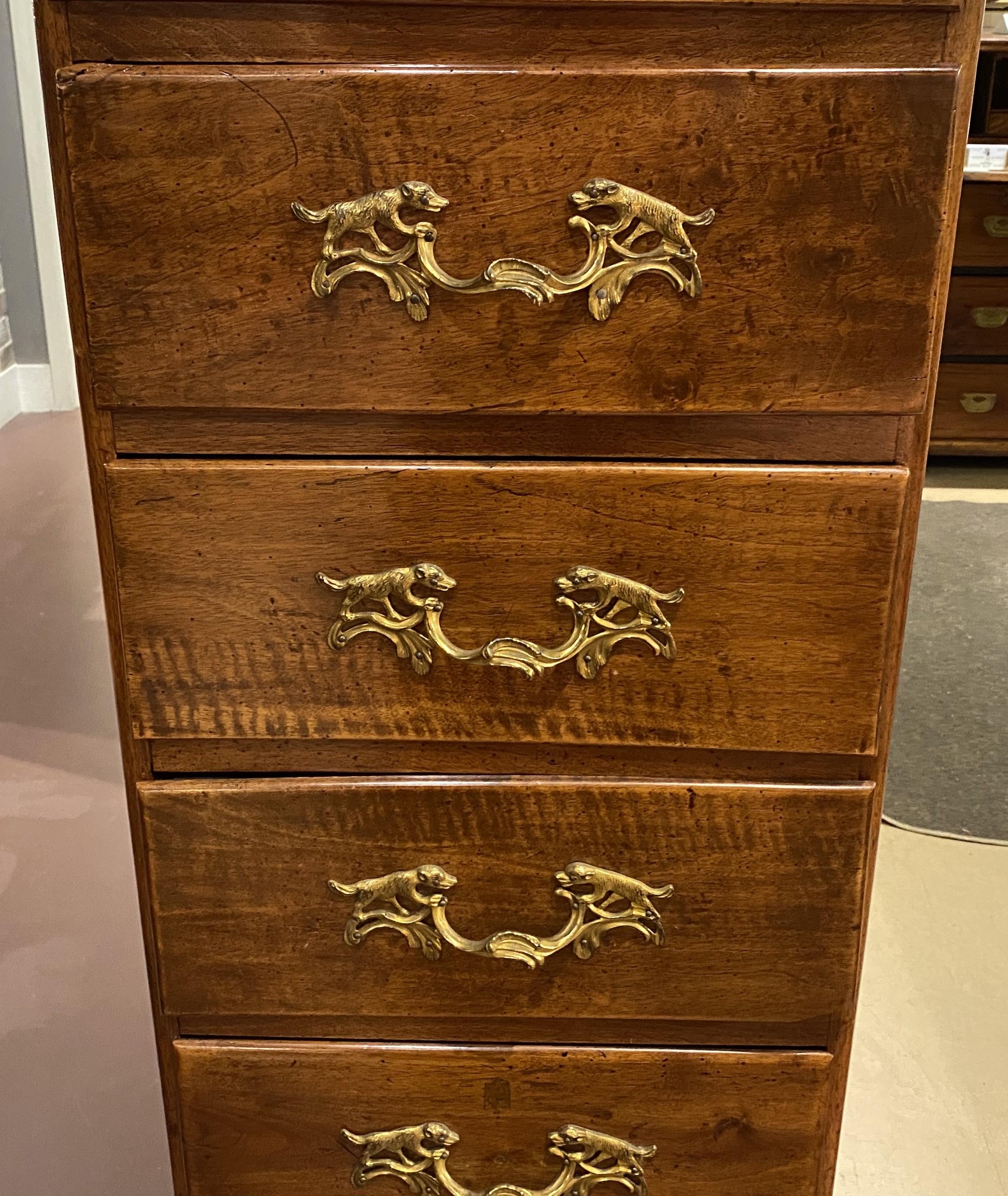 French 19th Century Continental Walnut Semainier with Dog Motif Drawer Pulls For Sale