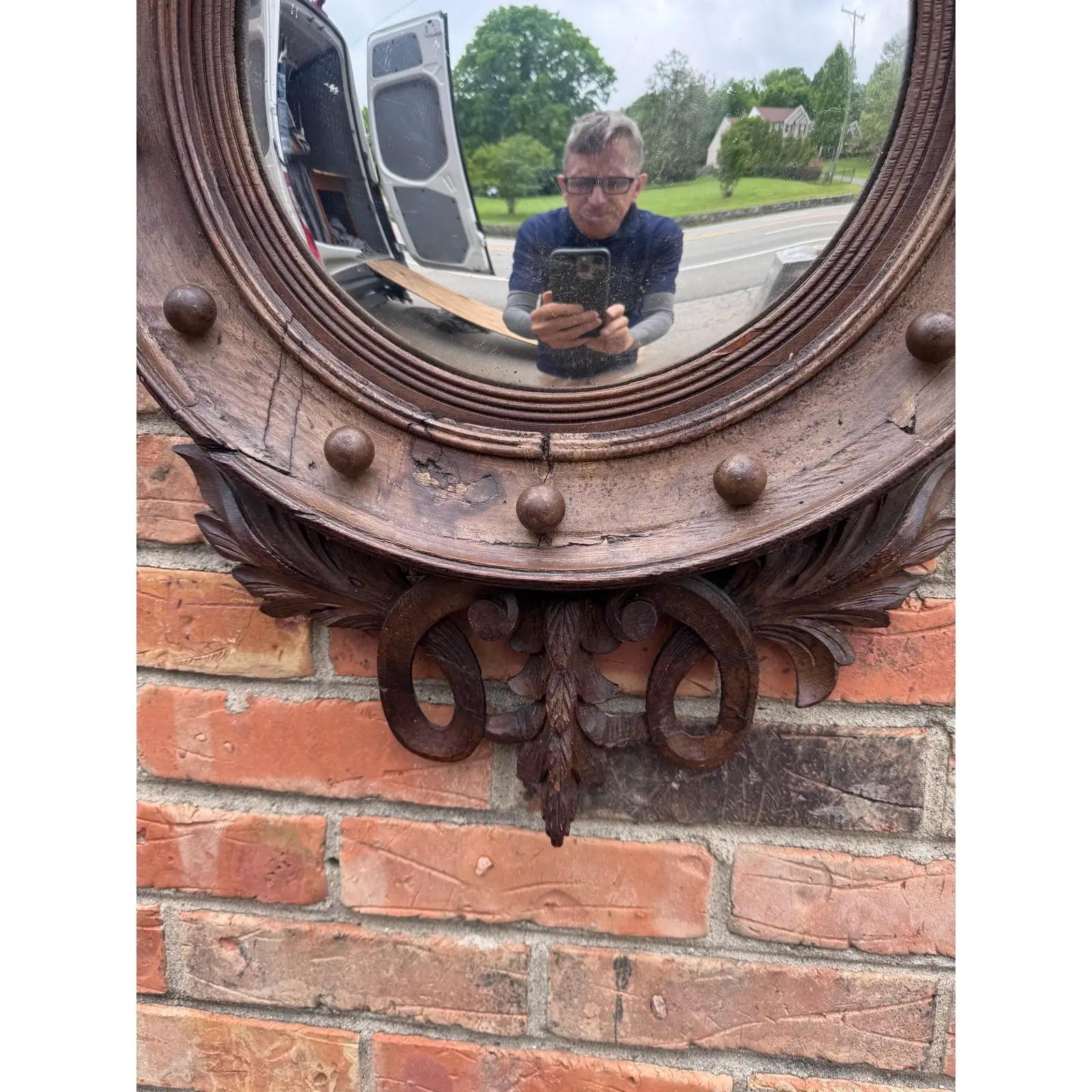 This is a very unusual early 19th century English porthole convex wall mirror with the eagle a top. I never seen a wooden one most are gilt over wood. This will compliment many home decors from traditional, cottage, mid century or Americana.
In very