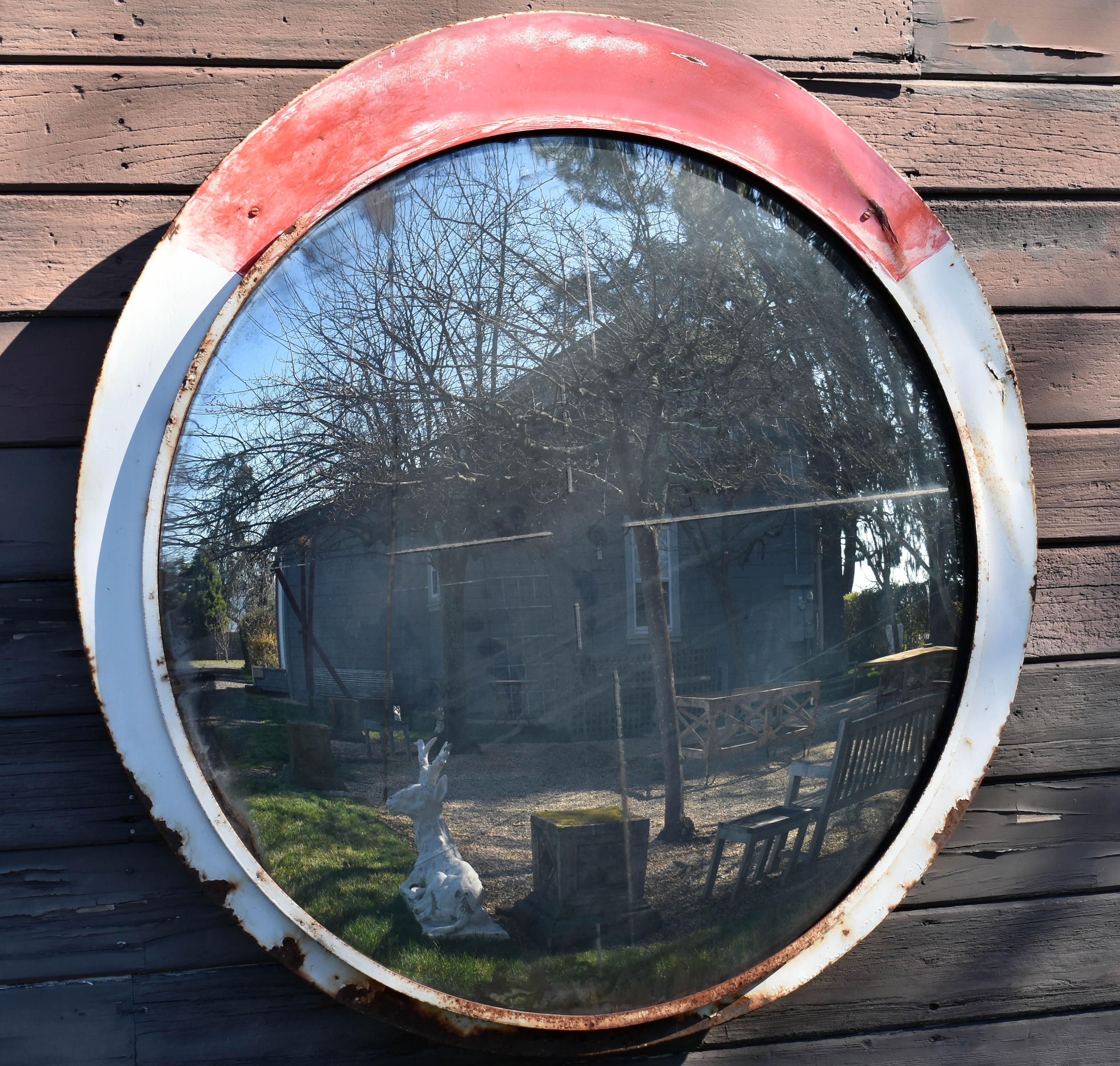 A fantastic opportunity to acquire a hard to find piece, the mirror is very rare and sought after. Originally found on railways in Eastern Europe. Large vintage round train mirror with elliptical frame extending below mirror edge, circa 19th