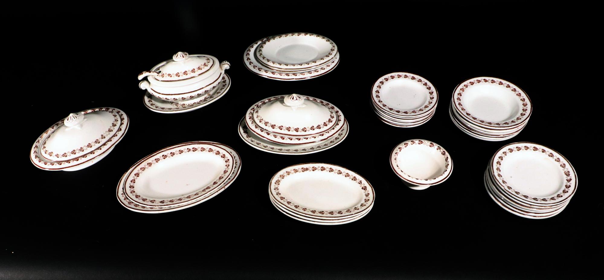 Copeland Pottery Miniature Child's Dinner Set,
1847-90

The Copeland pottery miniature child's dinner set consists of 29 pieces.  It has a creamy color ground with a band of puce leaves around the rim.

The service has a soup tureen, cover, stand,