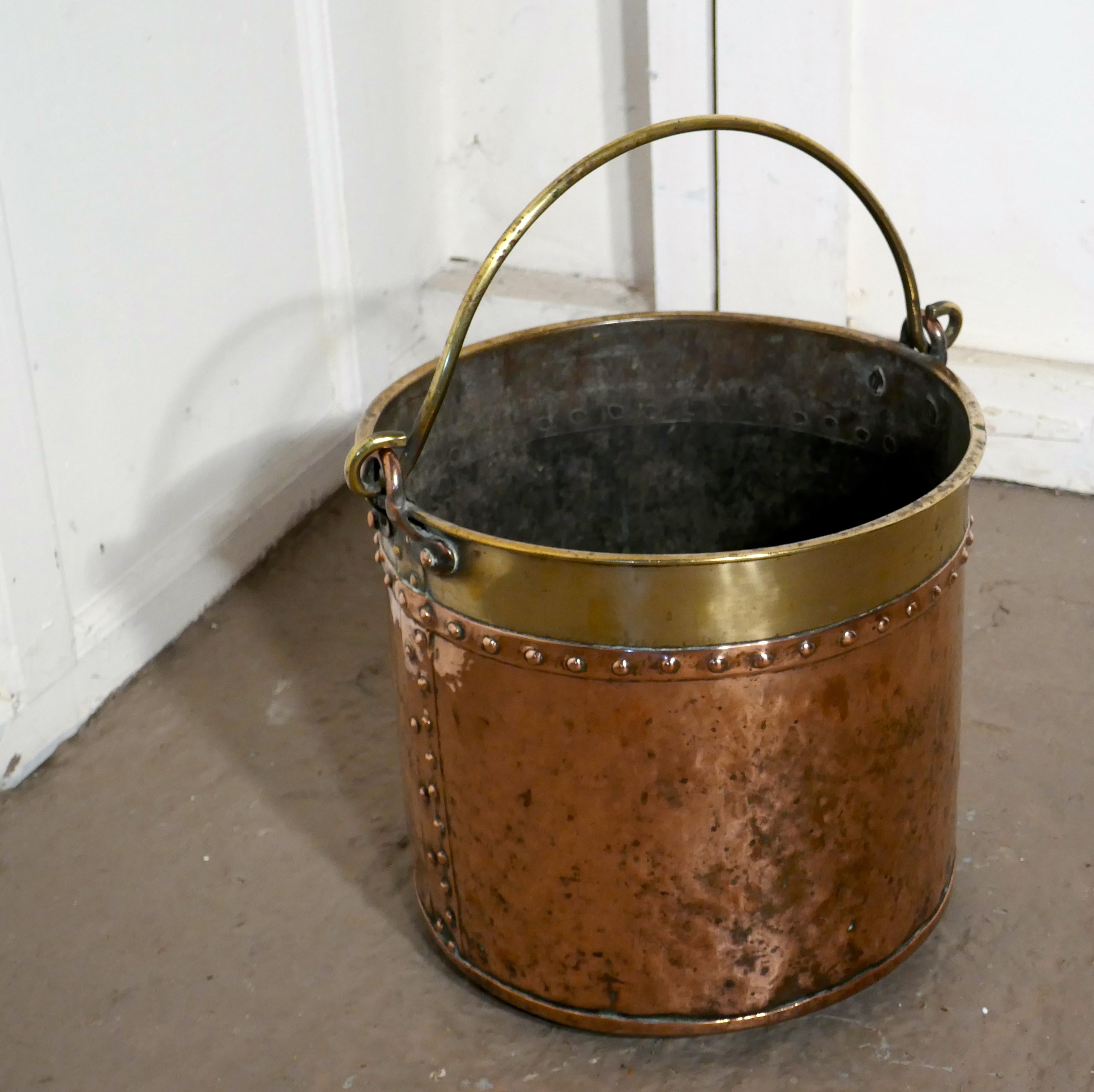 19th century copper and brass coal or log bucket

This is a lovely looking 19th century bucket it has a riveted base and circumference The bucket has a rolled top and the brass handle swings through 180 degrees
It is in very good sound with the
