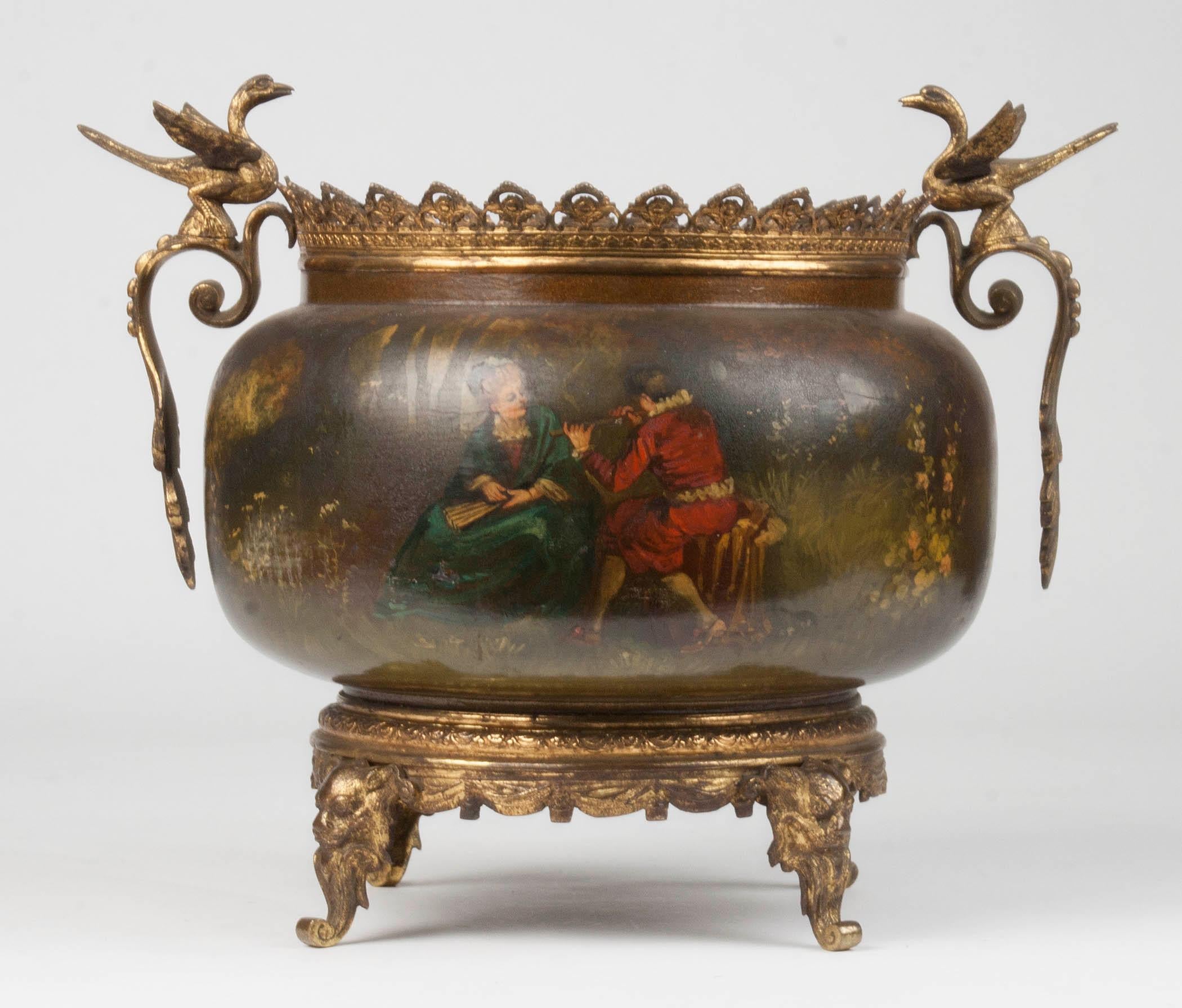 Beautiful flowerpot made of copper with a bronze base. The copper is painted with a romantic scene, this is also called 'Vernis Martin'. It is a painting technique that originated in France and is intended as an imitation of Japanese lacquerware.