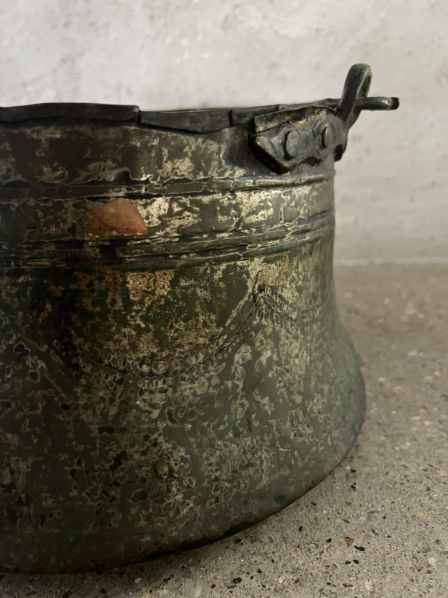 Beautiful handcrafted pot with incredible patina and detail. 