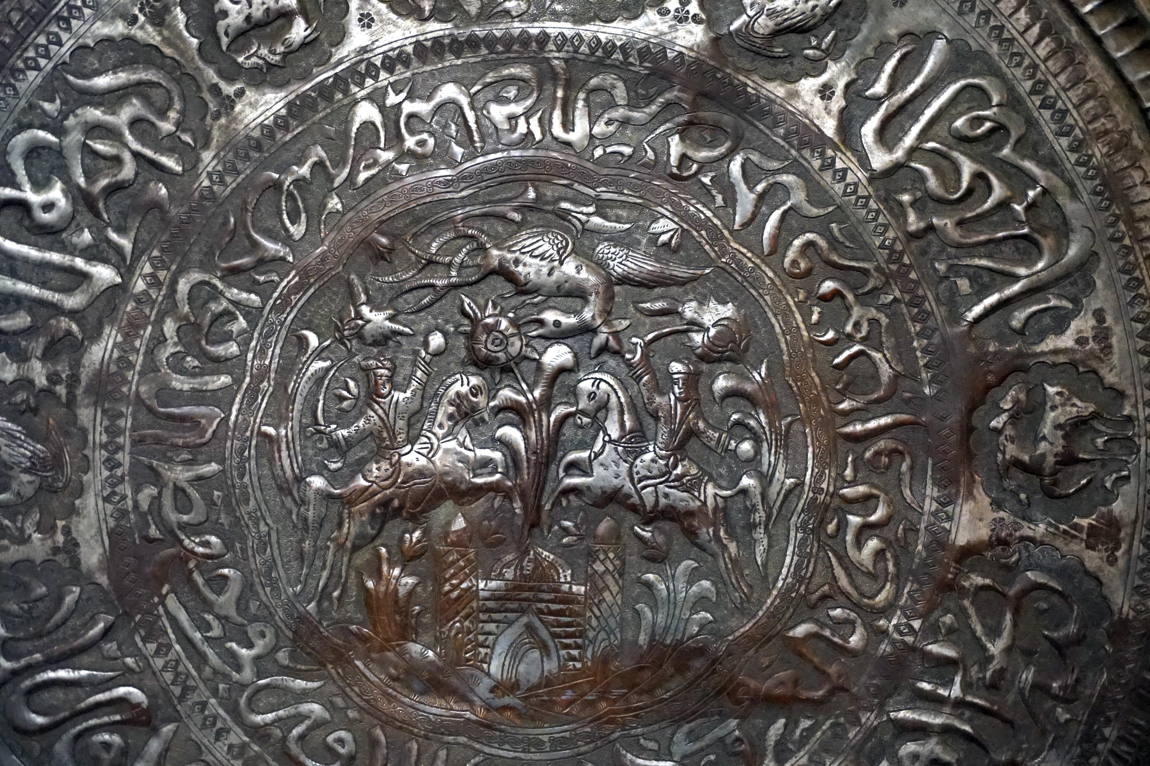 
An antique low Ottoman Empire cast metal (copper, tin and bronze) circular tray-table, 19th Century or earlier; base late 19th Century or later. The circular piece can also be used as a 
This is an exquisite piece of Ottoman art with detailed