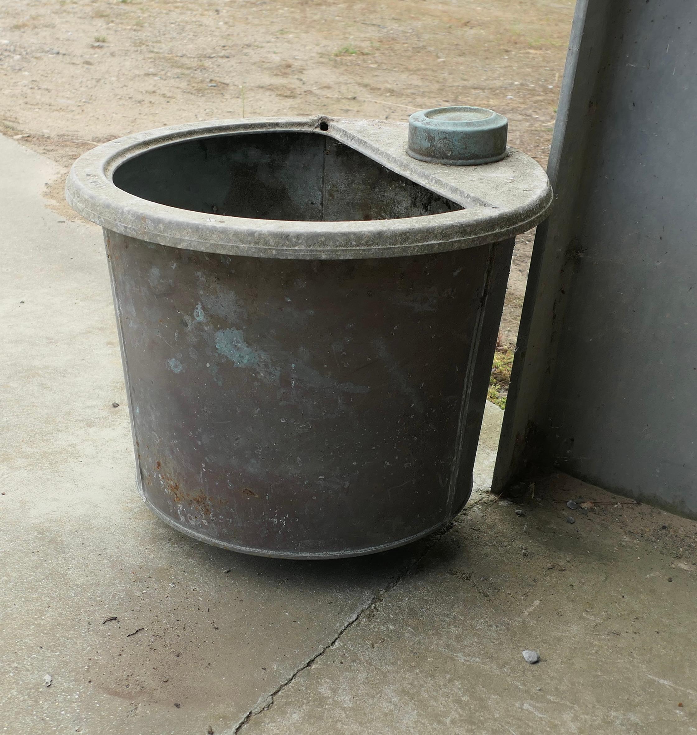19th Century Copper Cauldron Log Bin or Planter

This is a good heavy quality copper piece, it originates from an old laundry but is looking on to a new and useful life as a Log Bin or Planter
It has lots of the old fittings still attached and there