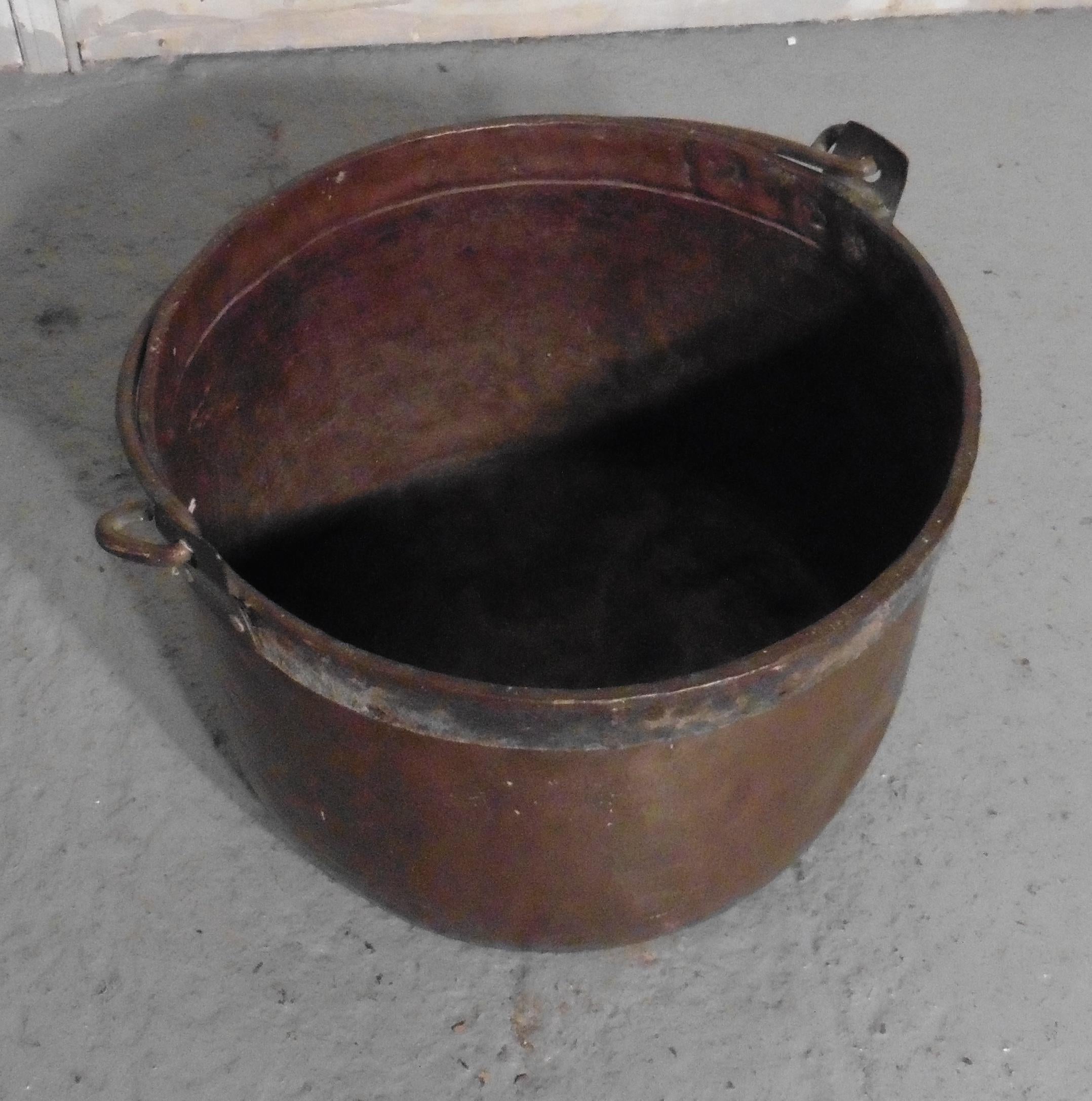 19th century copper cauldron or log bin

This is a lovely big copper cauldron, this is a good big piece and would make a really good log container and handy because it has a carrying handle 

The cauldron is in good well aged condition, it is