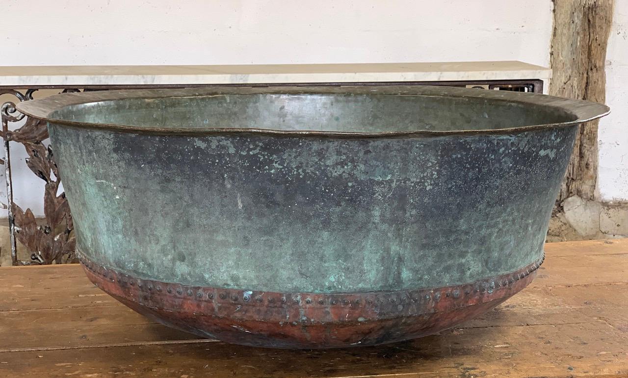 A lovely 19th century riveted copper cheese vat from France. With a nice natural verdigris. This will now make a wonderful garden planter.