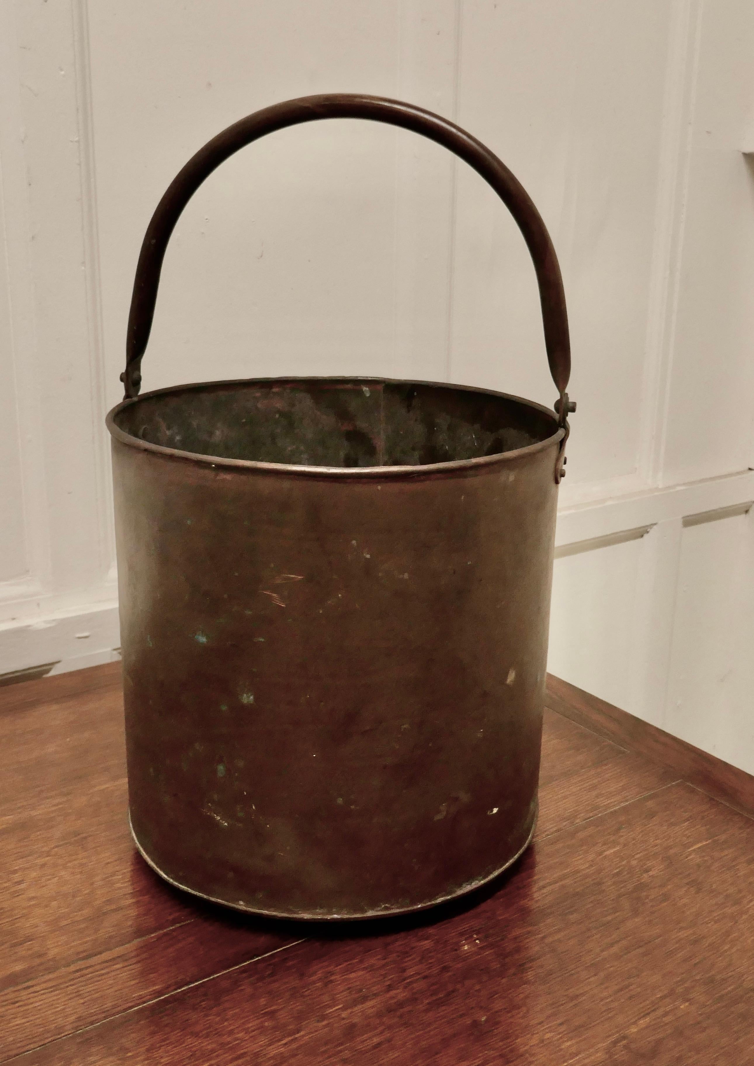 19th Century copper coal bucket 

This is a lovely big copper coal bucket, this is a good big piece and would make a really good coal or log container and handy because it has a riveted brass carrying handle

The cauldron is in good well aged